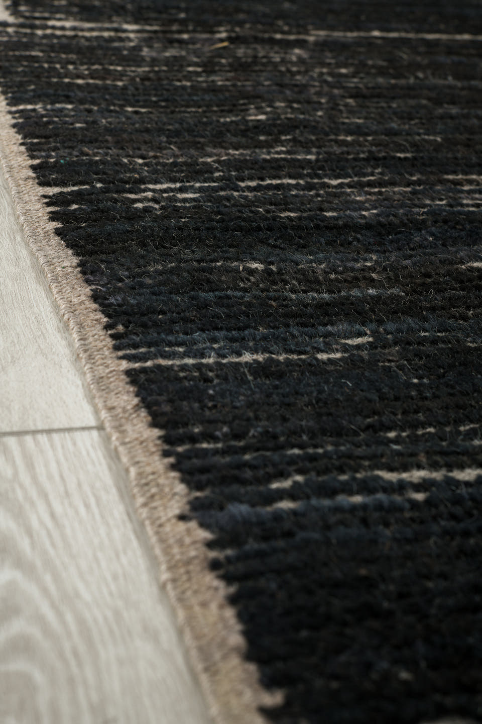 9' x 12' one-of-a-kind handmade vintage Tulu large size rug. Color palette: charcoal, ivory, ebony, taupe, gray, black