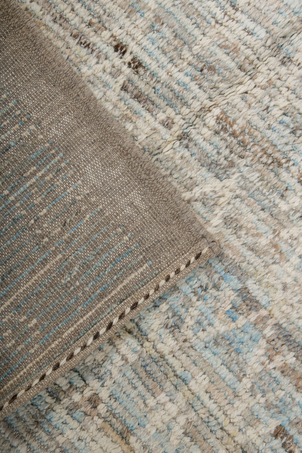 7' x 10' one-of-a-kind handmade vintage Tulu large size rug. Color palette: ivory, taupe, beige, pale blue, brown, cream