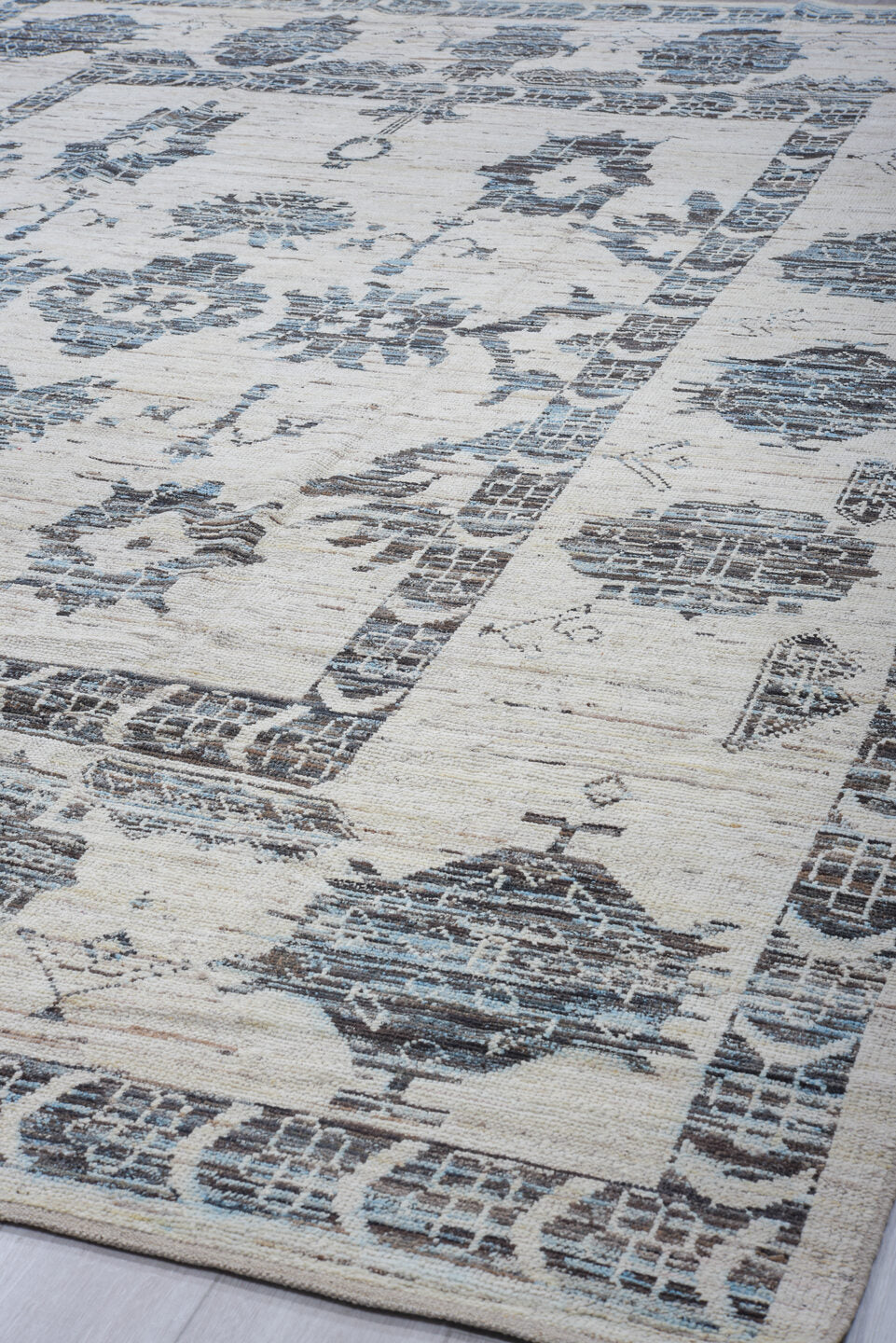9' x 13' one-of-a-kind handmade vintage Tulu large size rug. Color palette: ivory, charcoal, pale blue, slate, cream, gray