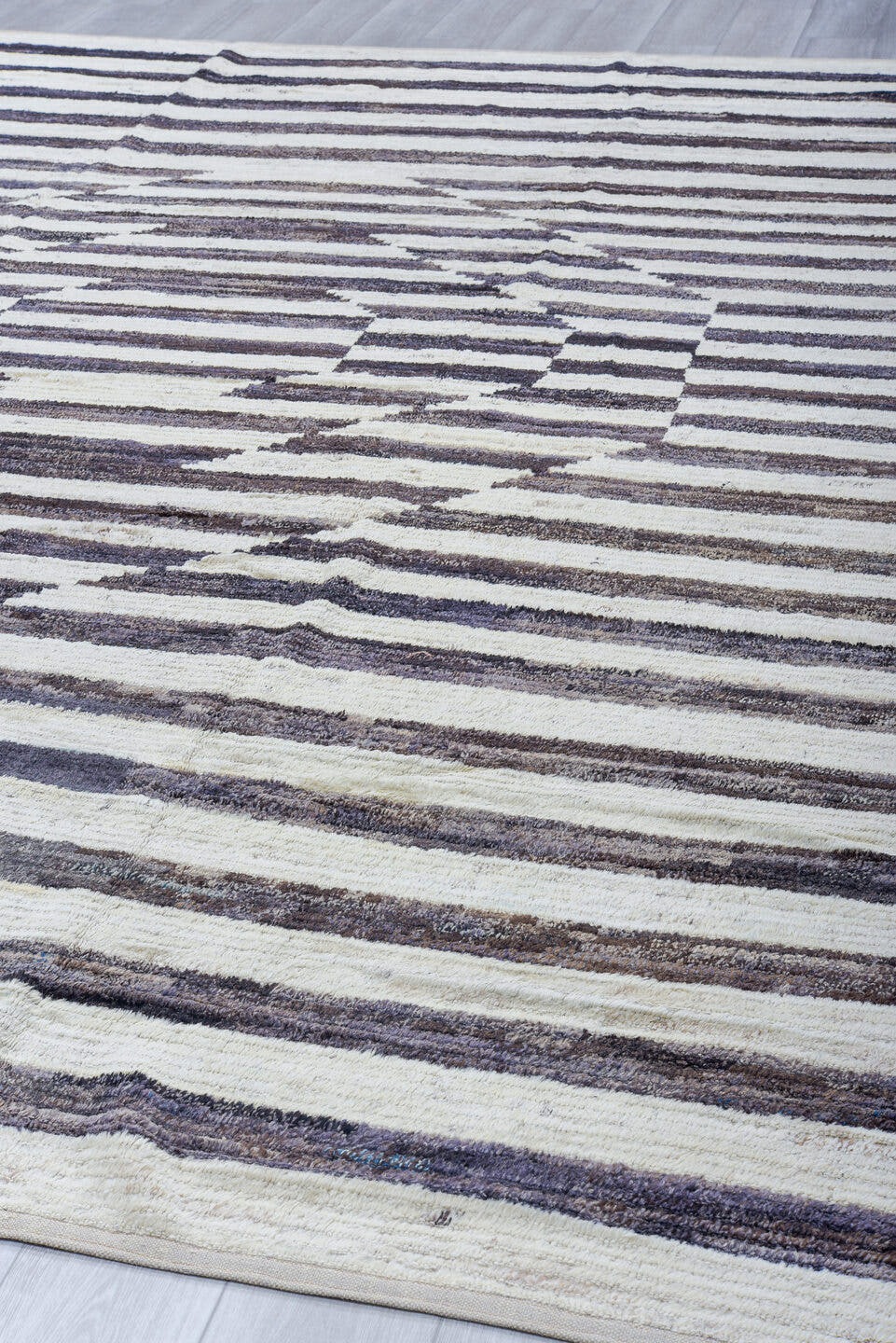 10' x 13' one-of-a-kind handmade vintage Tulu large size rug. Color palette: ivory, charcoal, gray, taupe, black, beige