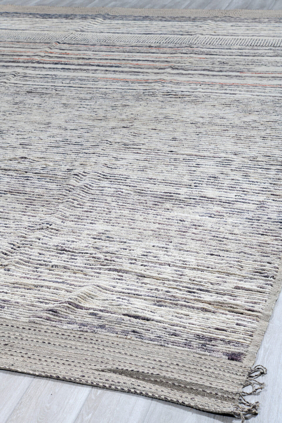 12' x 15' one-of-a-kind handmade vintage Tulu oversize rug. Color palette: ivory, charcoal, slate, rust, taupe, gray, black