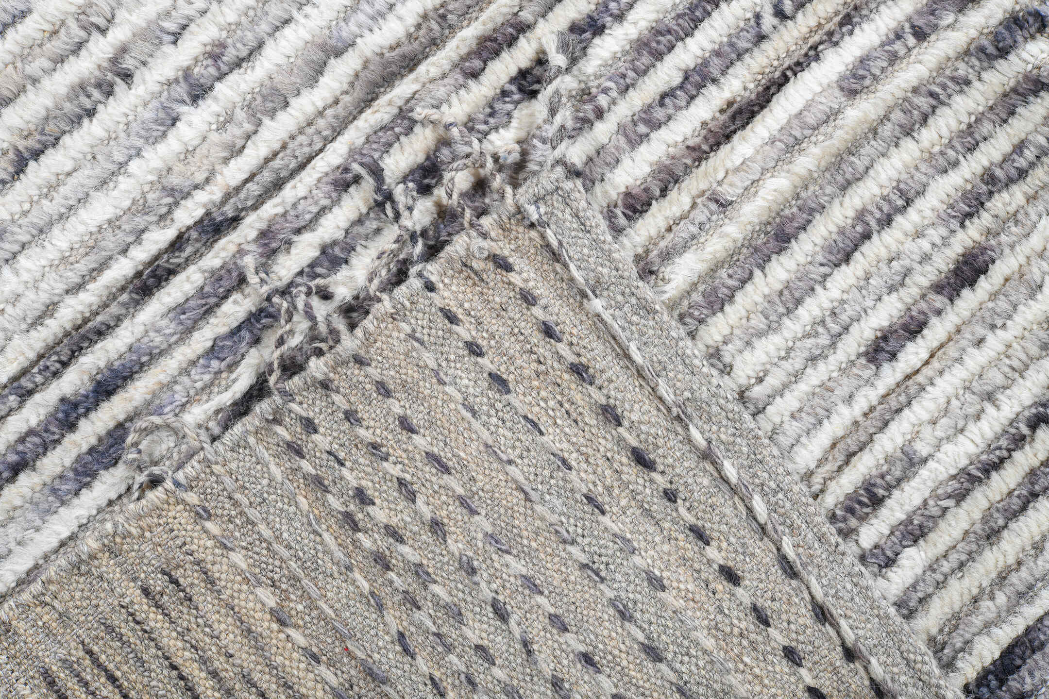 12' x 15' one-of-a-kind handmade vintage Tulu oversize rug. Color palette: ivory, charcoal, slate, rust, taupe, gray, black