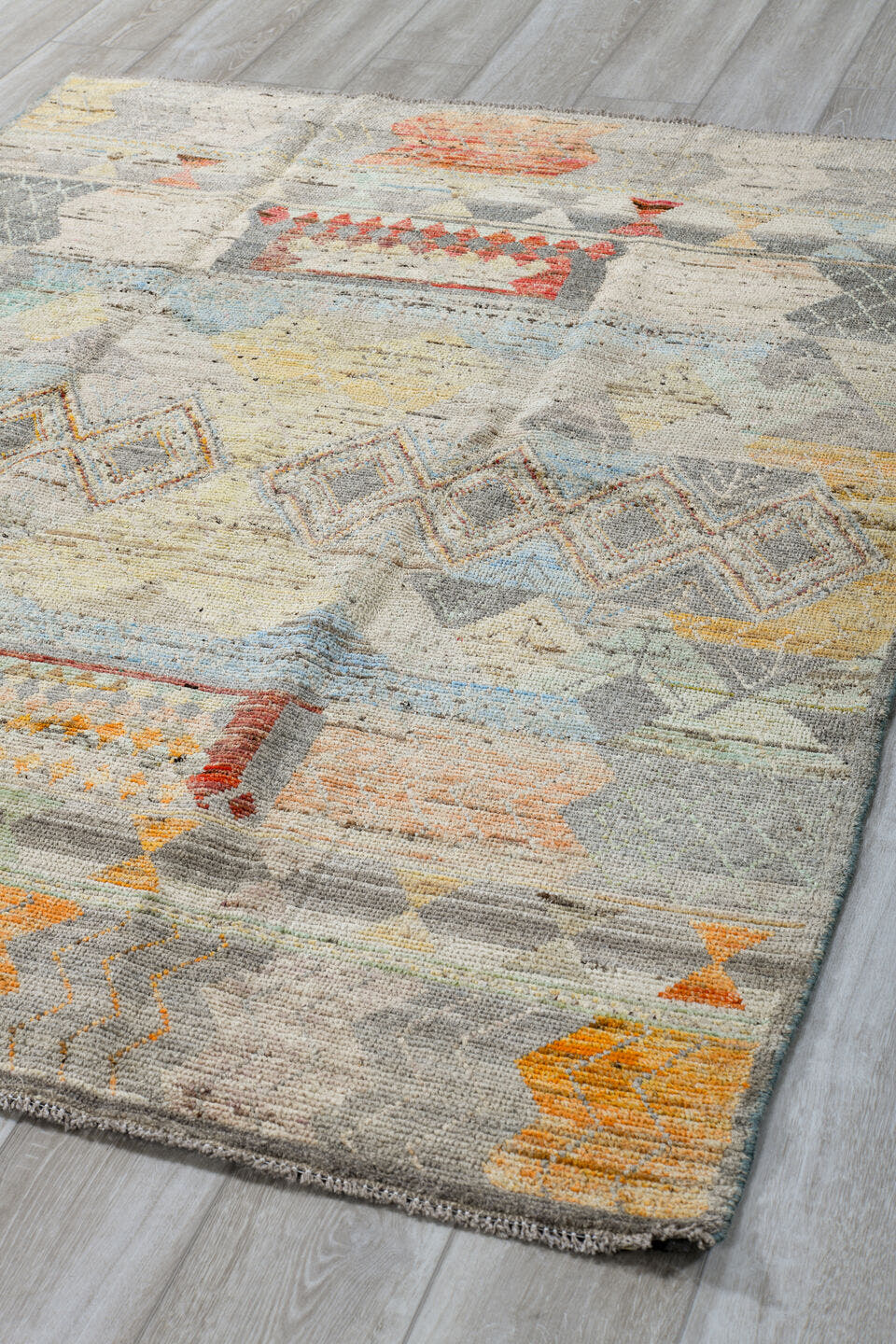 5' x 7' one-of-a-kind handmade vintage Tulu rug. Color palette: ivory, gray, terra cotta, pale blue, taupe, camel, sage