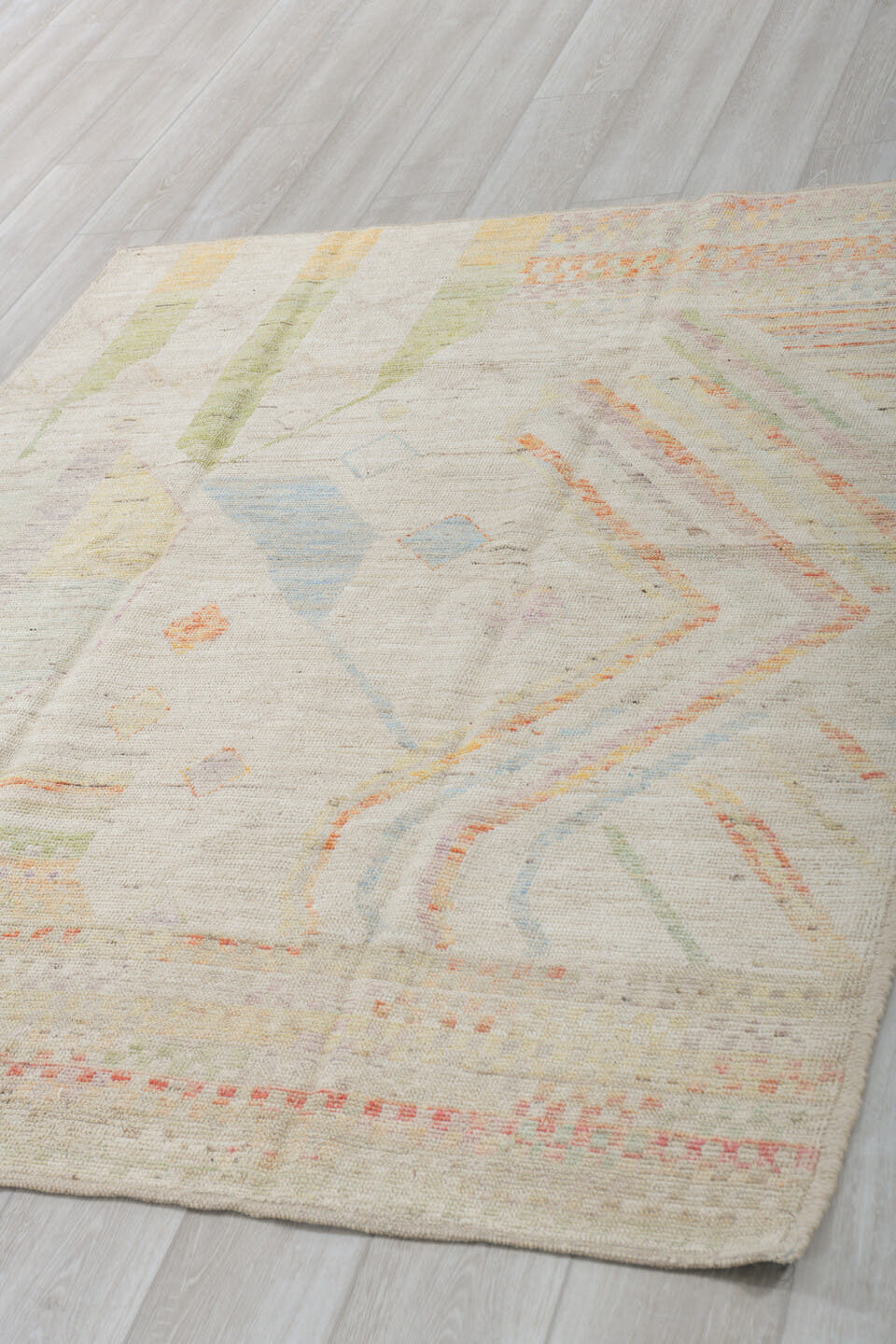 5' x 6' one-of-a-kind handmade vintage Tulu rug. Color palette: ivory, sage, apricot, pale blue, butter, taupe, green