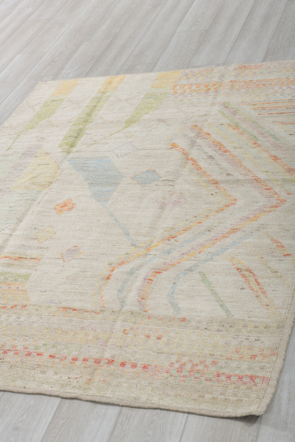 5' x 6' one-of-a-kind handmade vintage Tulu rug. Color palette: ivory, sage, apricot, pale blue, butter, taupe, green