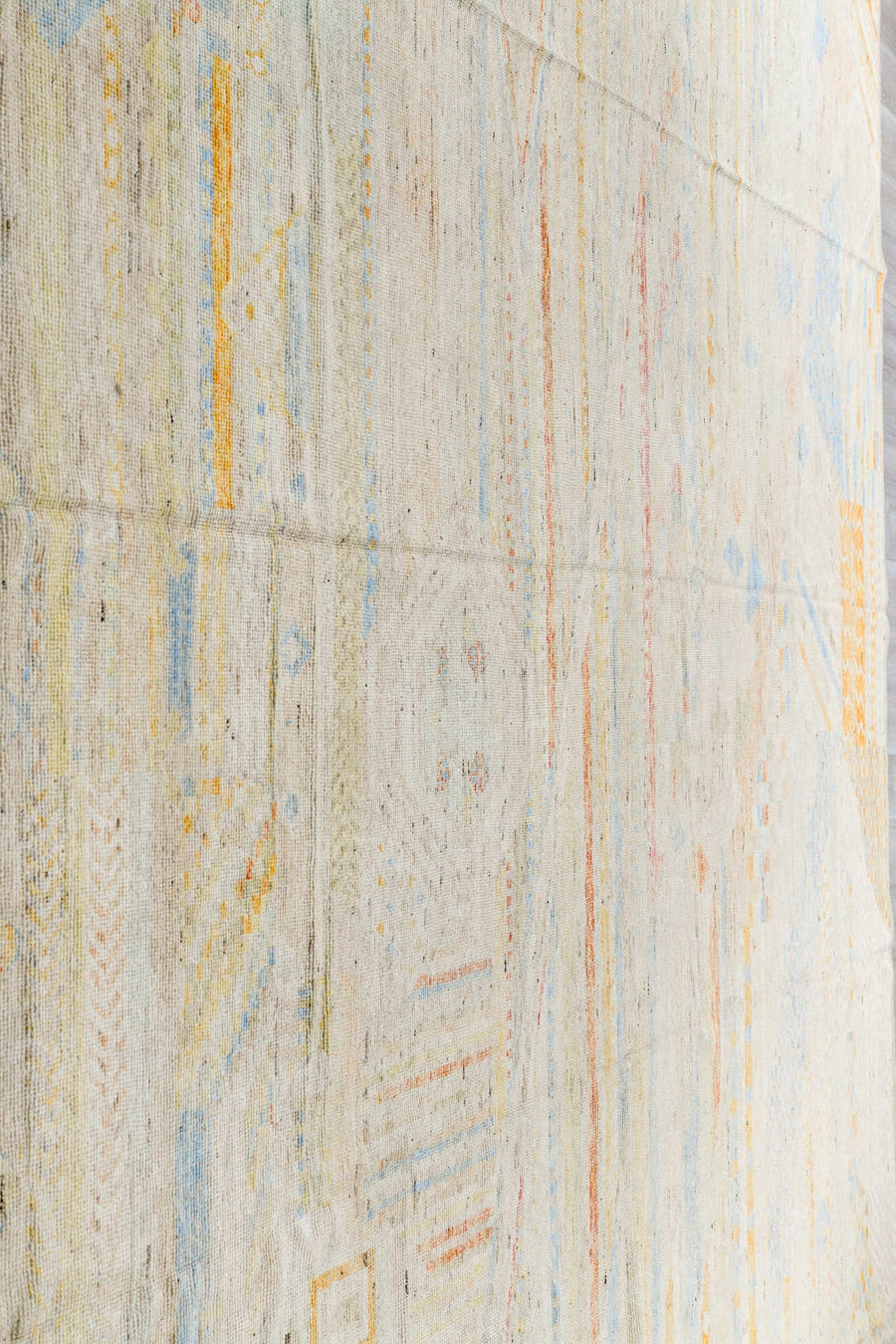 13' x 16' one-of-a-kind handmade vintage Tulu oversize rug. Color palette: ivory, pale blue, cream, saffron, soft coral