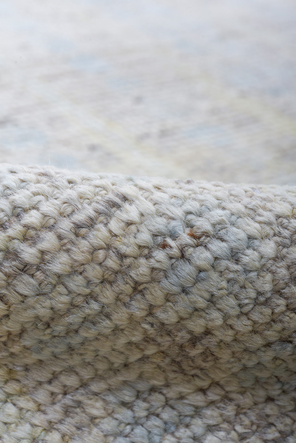13' x 16' one-of-a-kind handmade vintage Tulu oversize rug. Color palette: ivory, pale blue, cream, peach, taupe, light gray