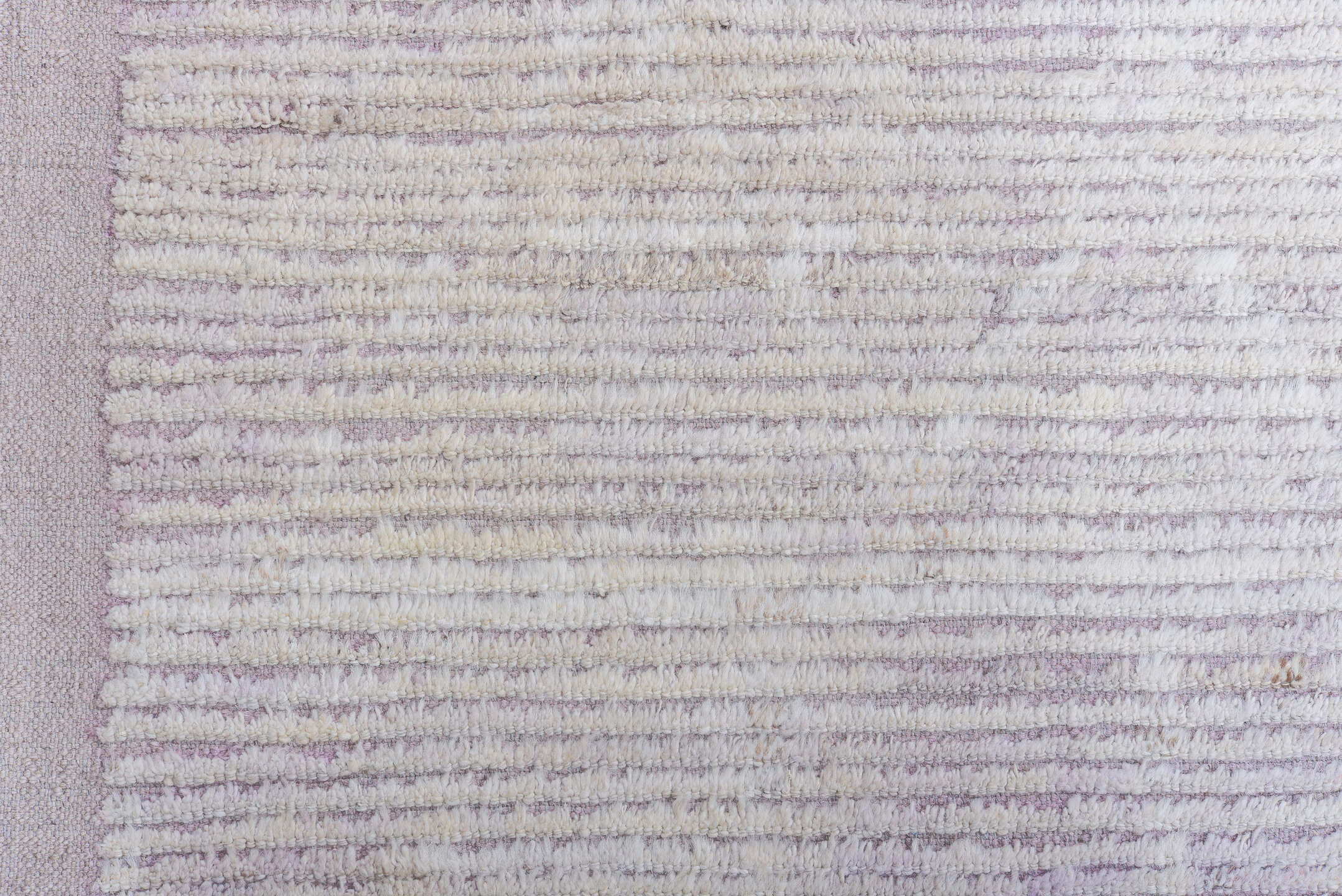 13' x 16' one-of-a-kind handmade vintage Tulu oversize rug. Color palette: ivory, pale lavender, taupe, cream, purple, pink