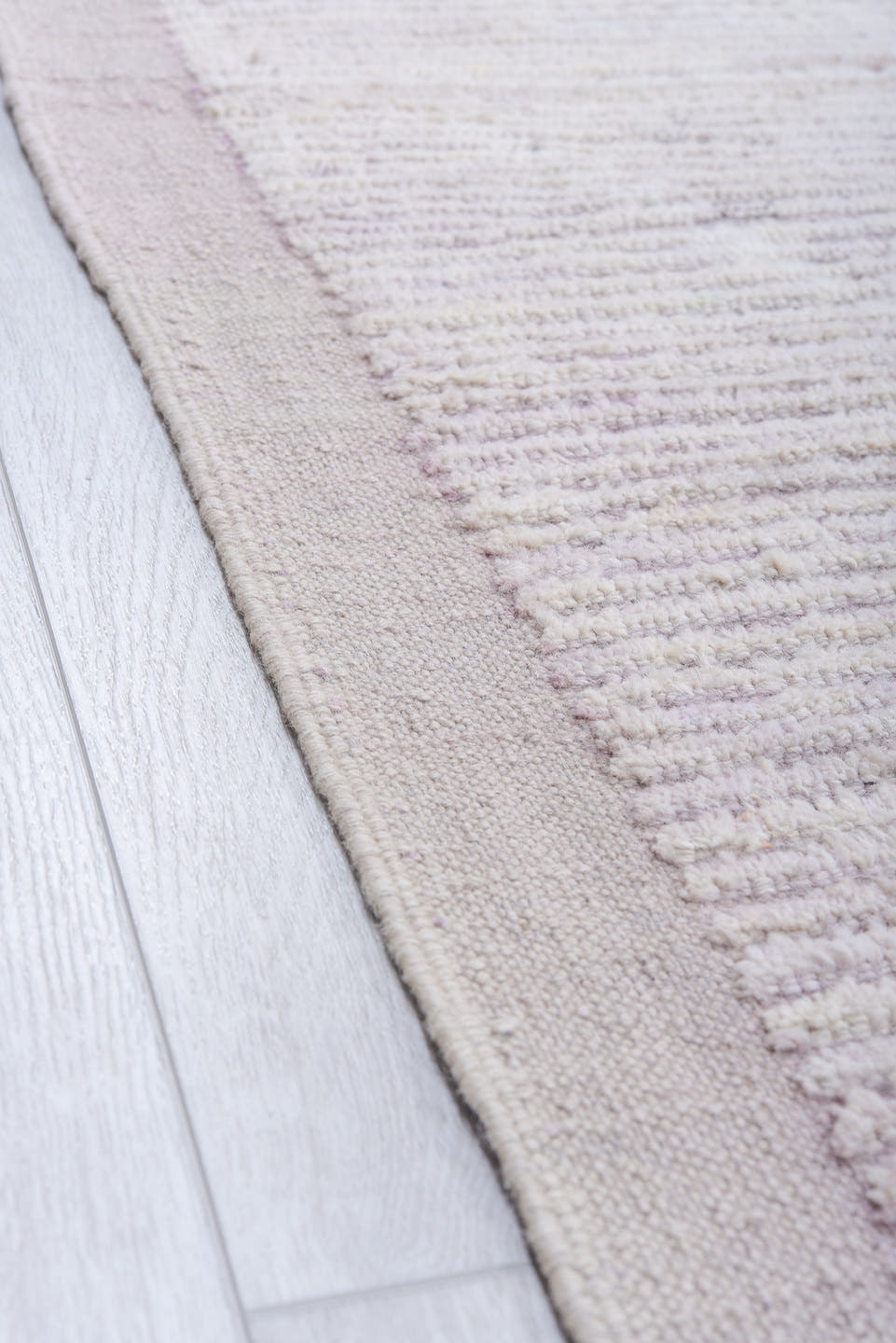 13' x 16' one-of-a-kind handmade vintage Tulu oversize rug. Color palette: ivory, pale lavender, taupe, cream, purple, pink