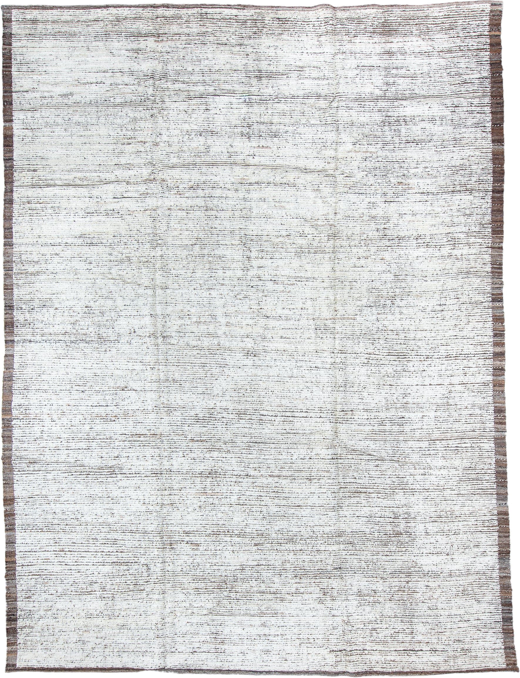 9' x 12' one-of-a-kind handmade vintage Tulu large size rug. Color palette: ivory, brown, taupe, charcoal, beige, gray
