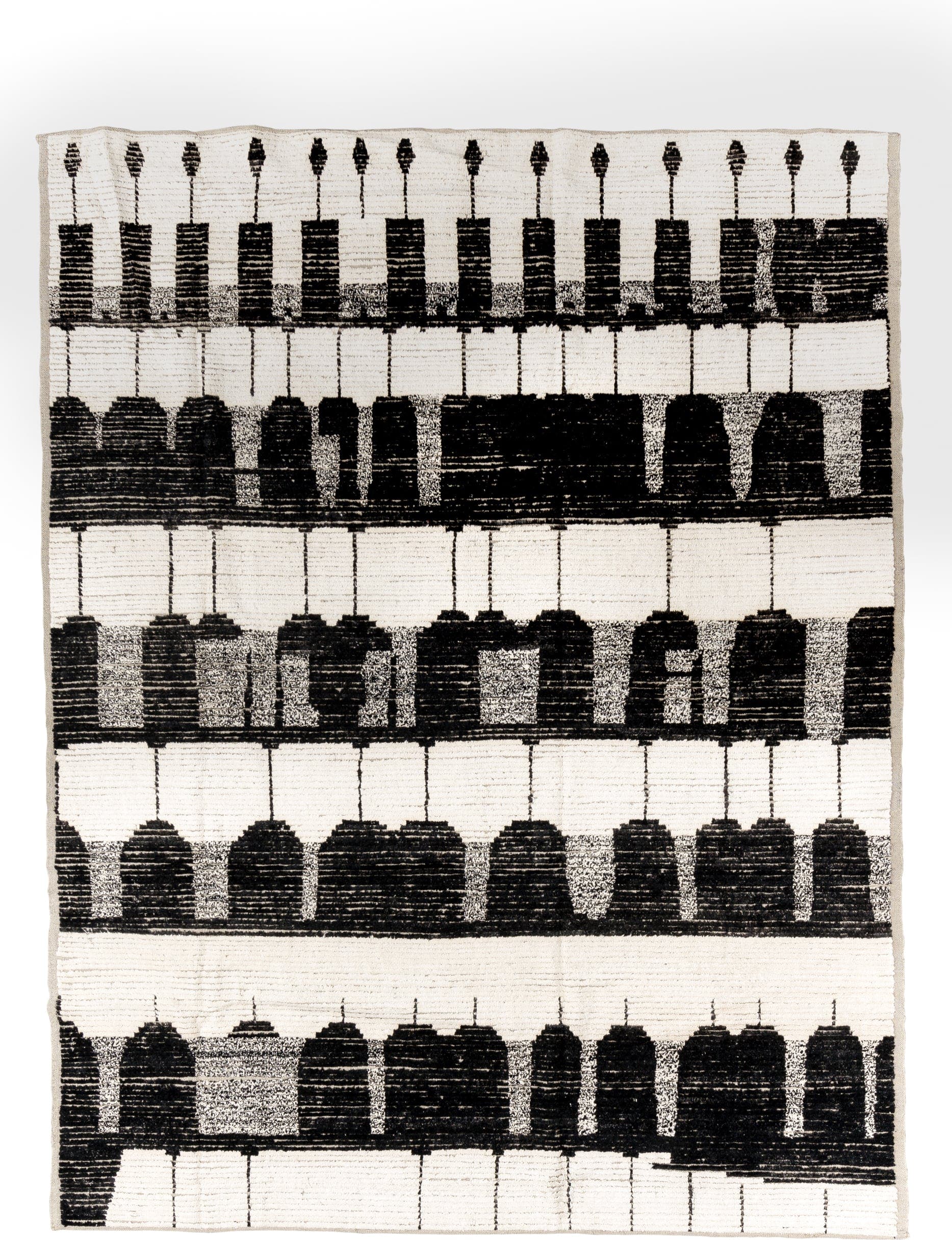 7' x 9' one-of-a-kind handmade vintage Tulu rug. Color palette: ivory, black, charcoal, gray