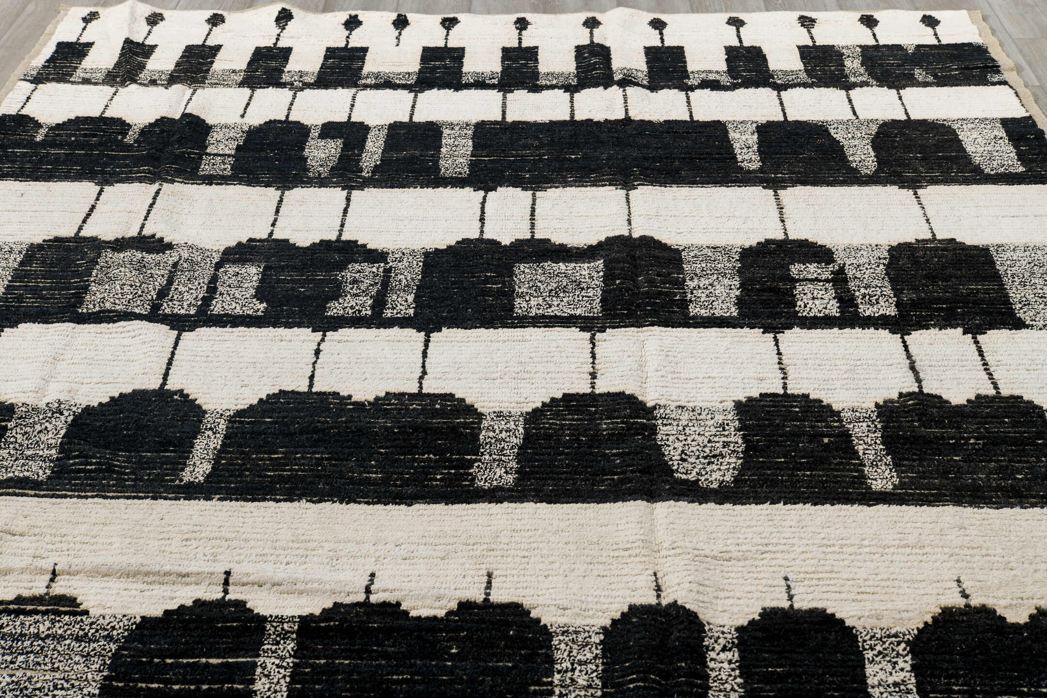 7' x 9' one-of-a-kind handmade vintage Tulu rug. Color palette: black, brown, charcoal, dark gray, gainsboro, gray