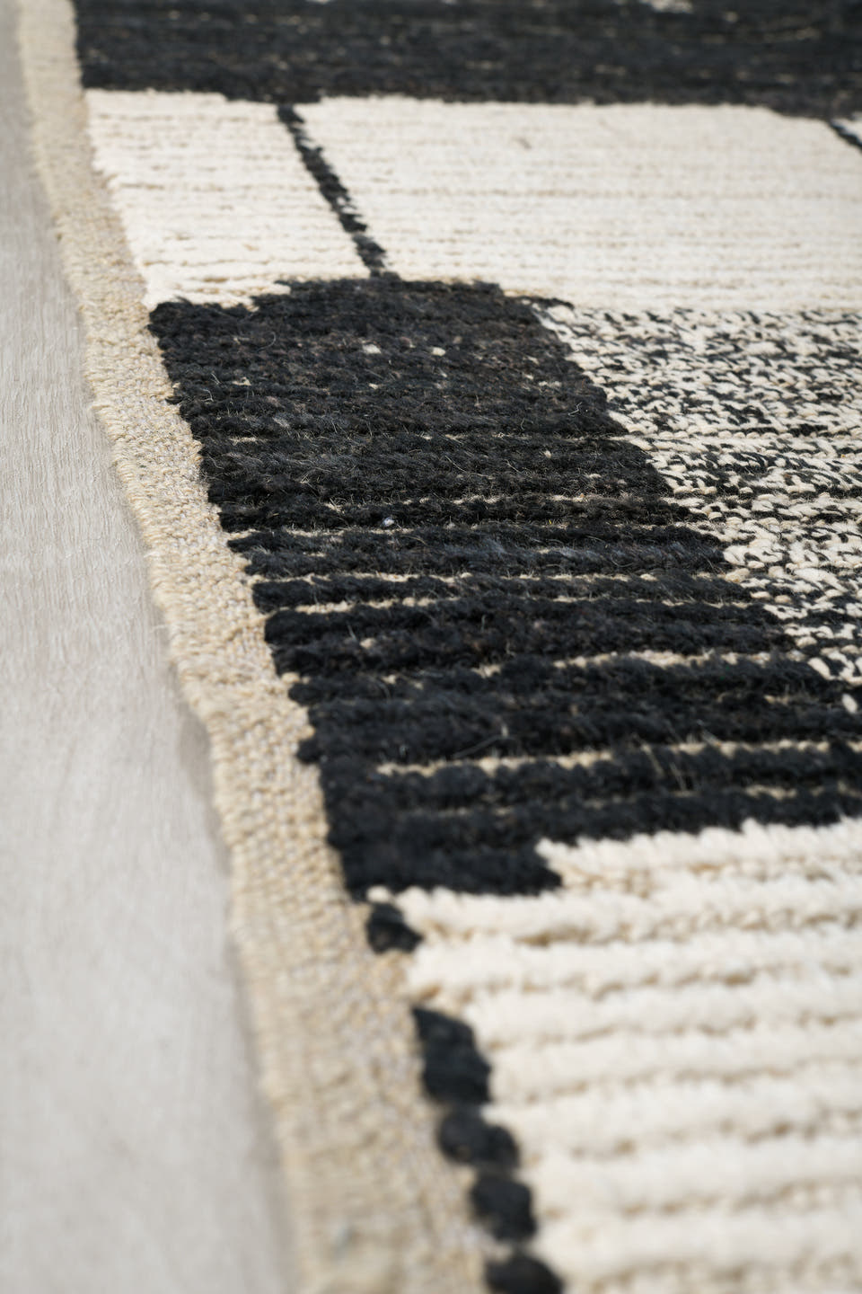7' x 9' one-of-a-kind handmade vintage Tulu rug. Color palette: ivory, black, charcoal, gray