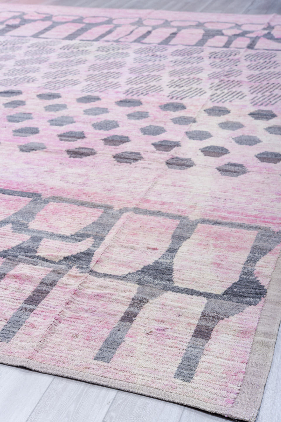 12' x 15' one-of-a-kind handmade vintage Tulu oversize rug. Color palette: pink, ivory, charcoal, gray, black