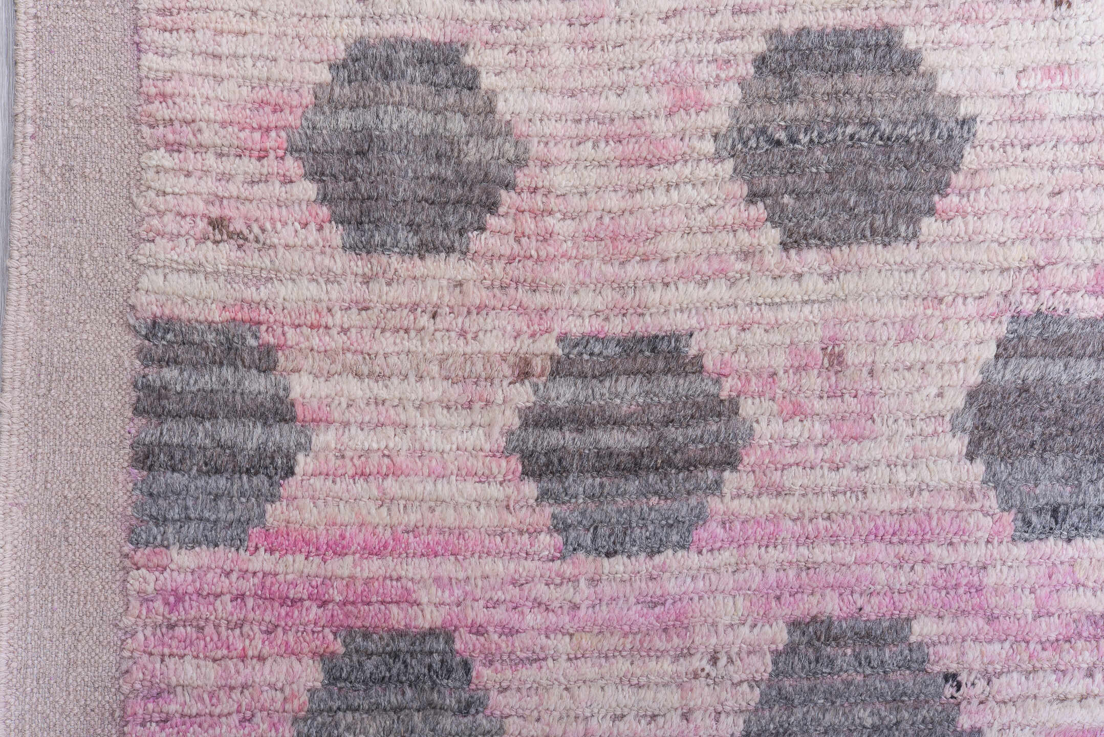 12' x 15' one-of-a-kind handmade vintage Tulu oversize rug. Color palette: pink, ivory, charcoal, gray, black