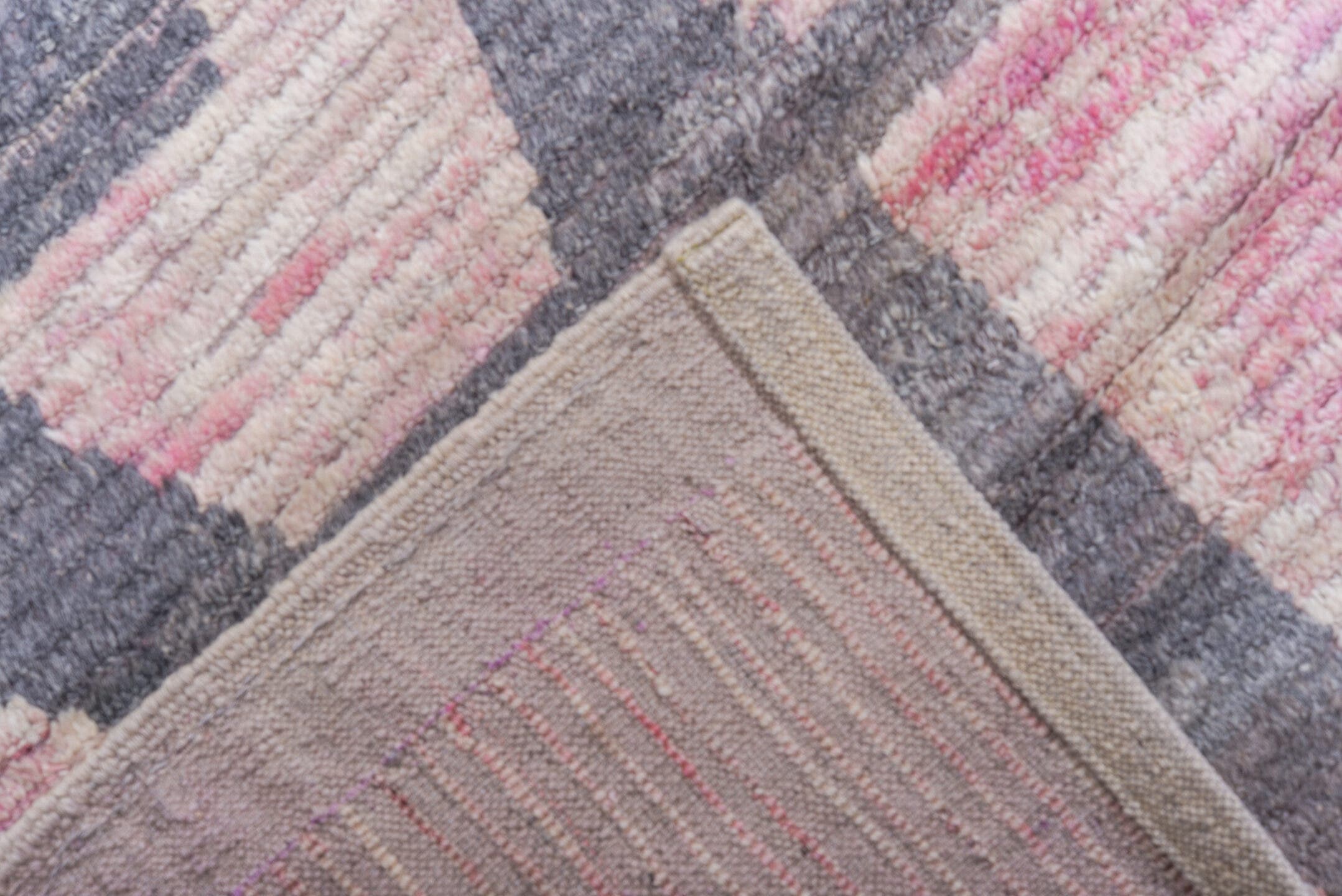 12' x 15' one-of-a-kind handmade vintage Tulu oversize rug. Color palette: pink, ivory, charcoal, gray, black