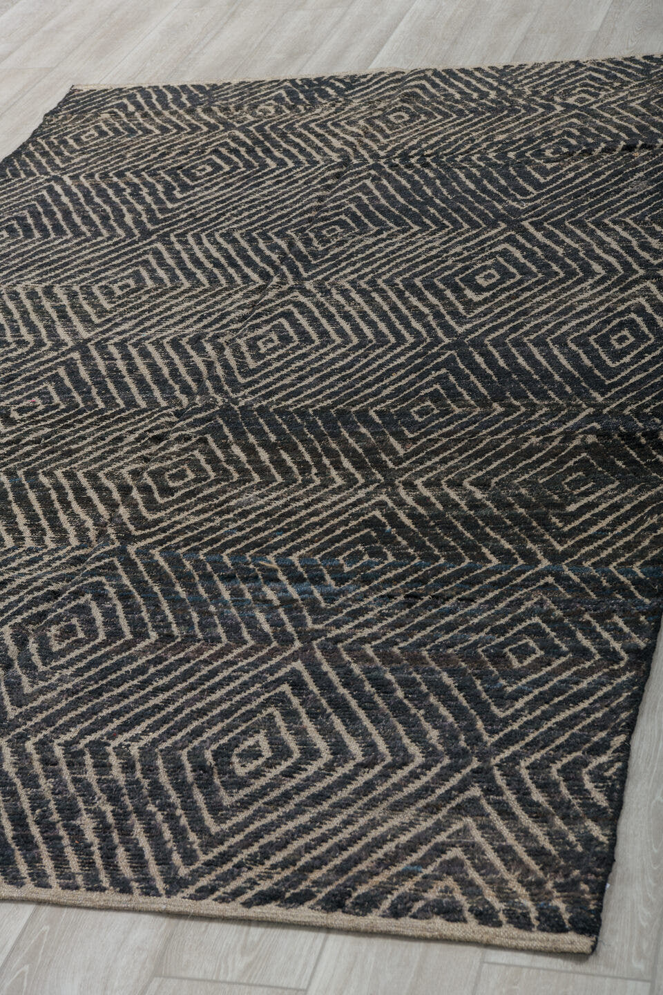 5' x 9' one-of-a-kind handmade vintage Tulu medium size rug. Color palette: ivory, charcoal, black, slate, gray