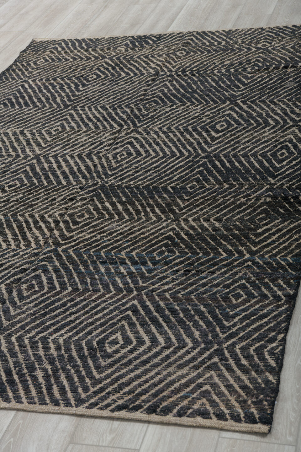 5' x 9' one-of-a-kind handmade vintage Tulu medium size rug. Color palette: ivory, charcoal, black, slate, gray