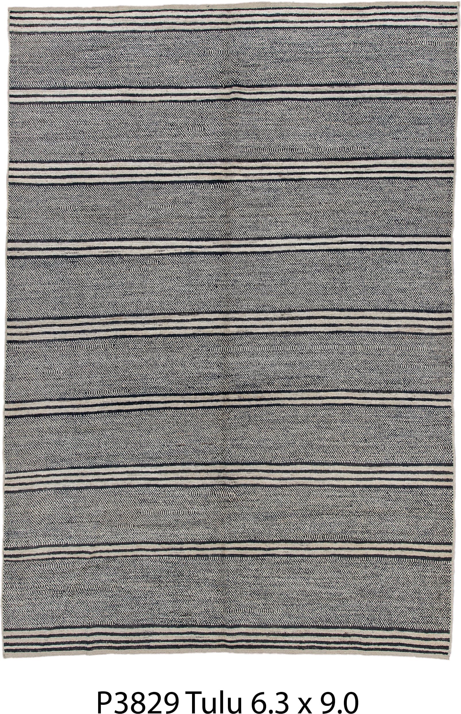 6' x 9' one-of-a-kind handmade vintage Tulu medium size rug. Color palette: charcoal, ivory, gray, black