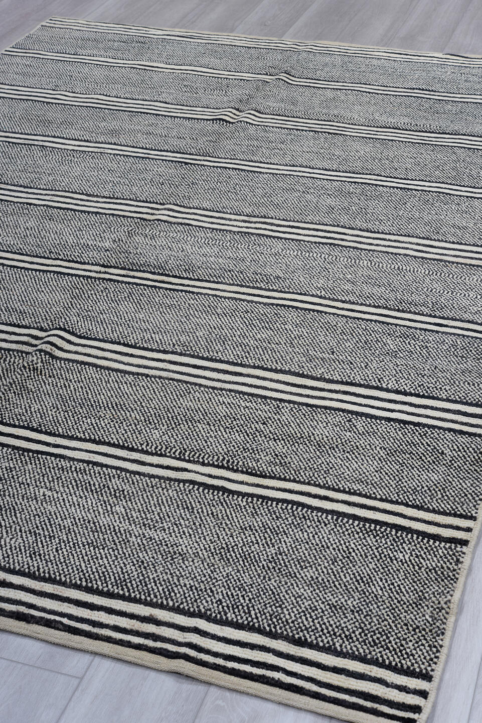 6' x 9' one-of-a-kind handmade vintage Tulu medium size rug. Color palette: black, blue, charcoal, dark gray, dim gray