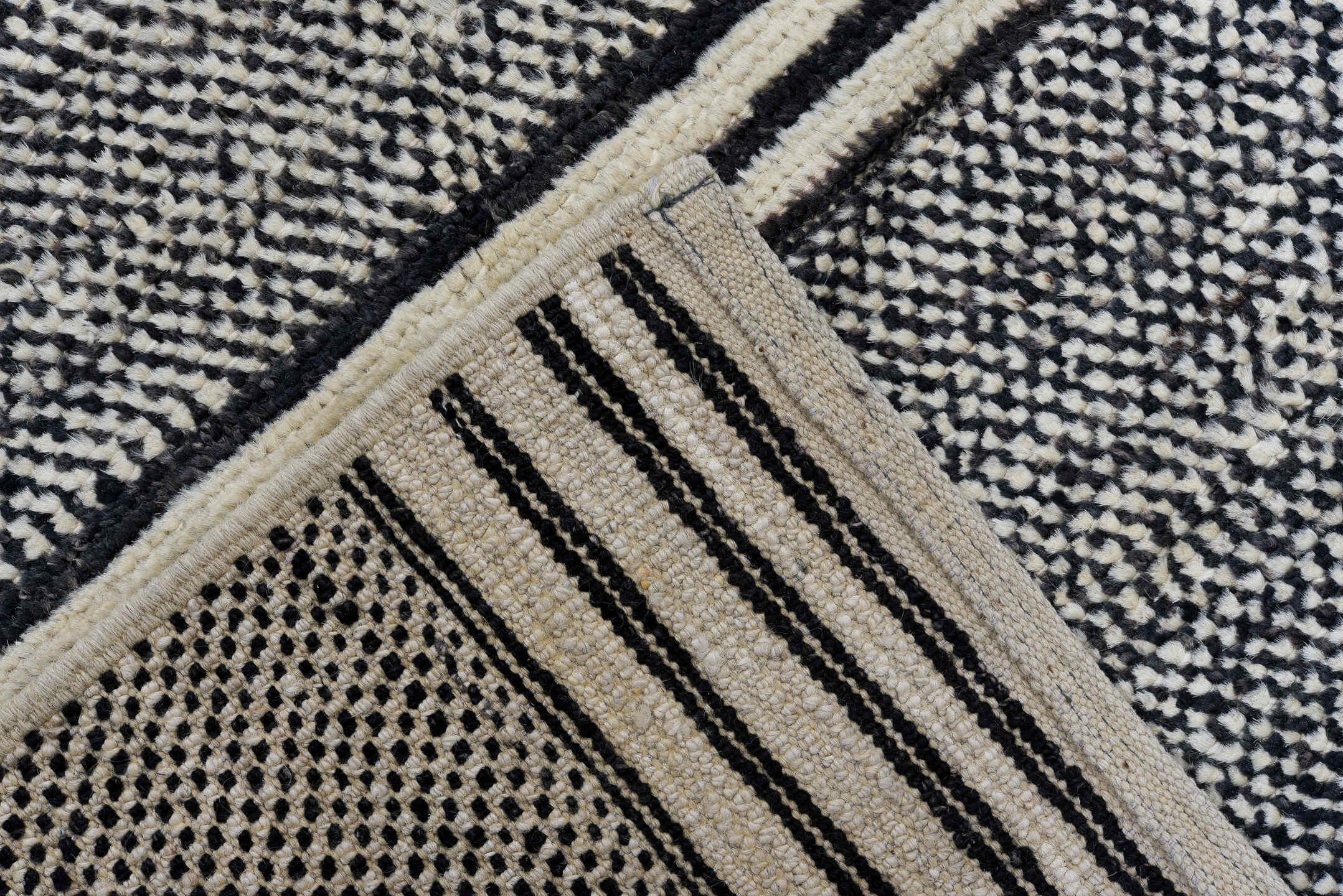 6' x 9' one-of-a-kind handmade vintage Tulu medium size rug. Color palette: charcoal, ivory, gray, black