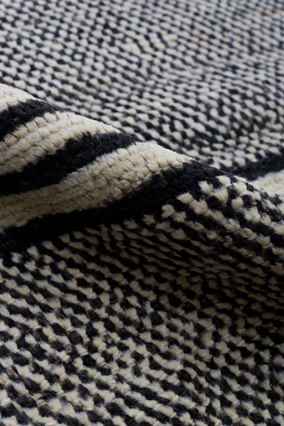 6' x 9' one-of-a-kind handmade vintage Tulu medium size rug. Color palette: charcoal, ivory, gray, black