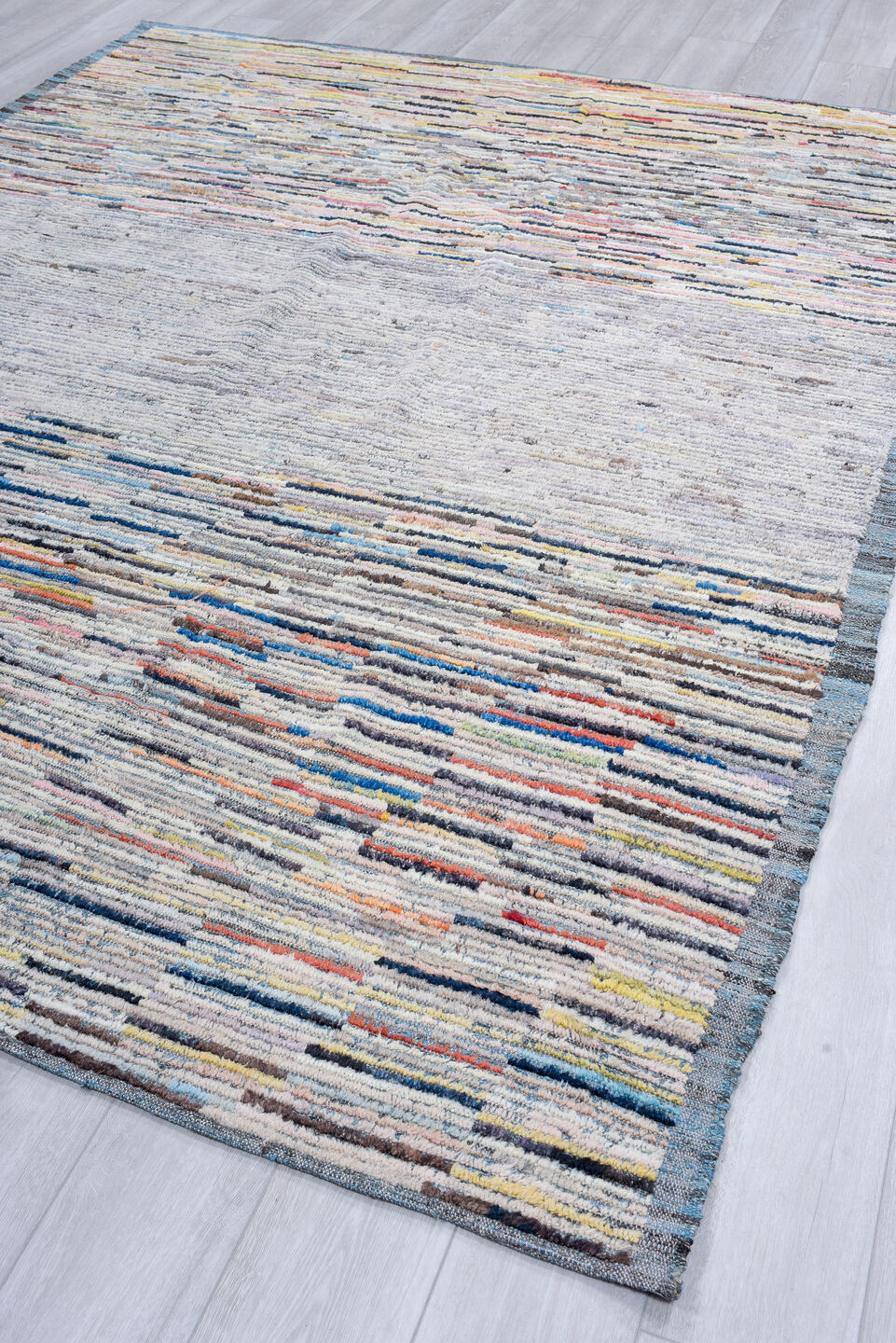 7' x 9' one-of-a-kind handmade vintage Tulu rug. Color palette: gray, ivory, slate, charcoal, taupe, blush, rust, blue
