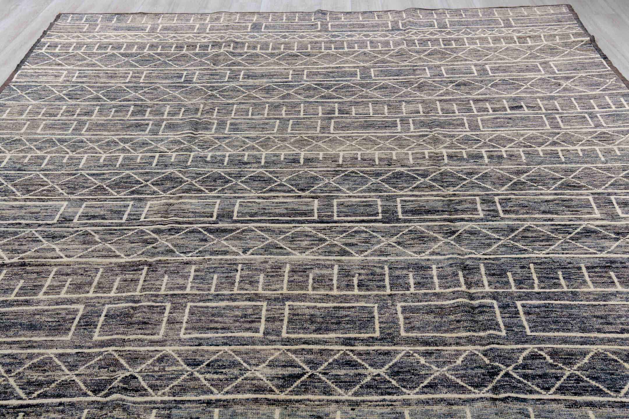 9' x 11' one-of-a-kind handmade vintage Tulu large size rug. Color palette: black, blue, brown, charcoal, dark gray