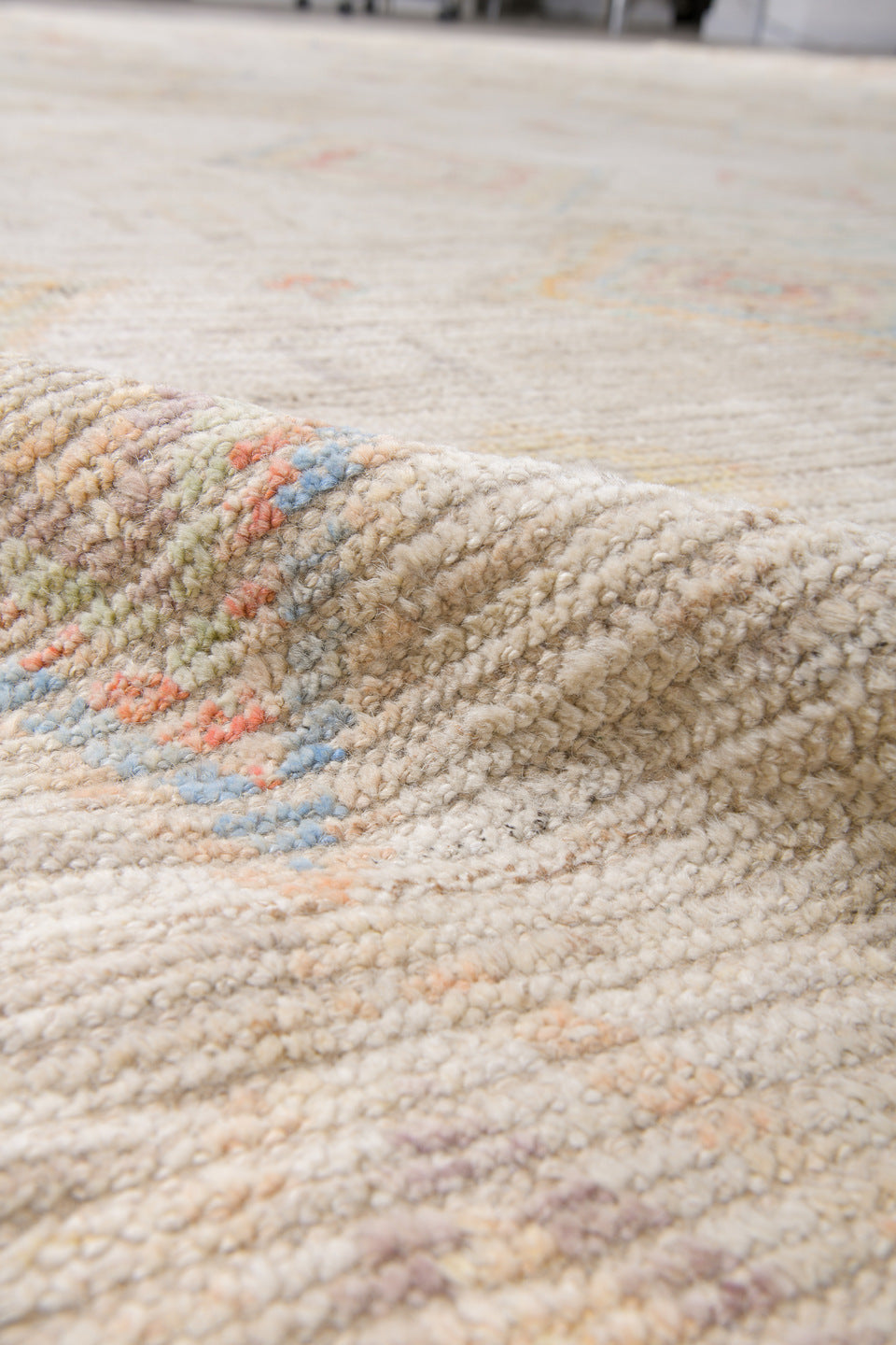 12' x 15' one-of-a-kind handmade vintage Tulu oversize rug. Color palette: ivory, cream, pale blue, coral, gold, sage