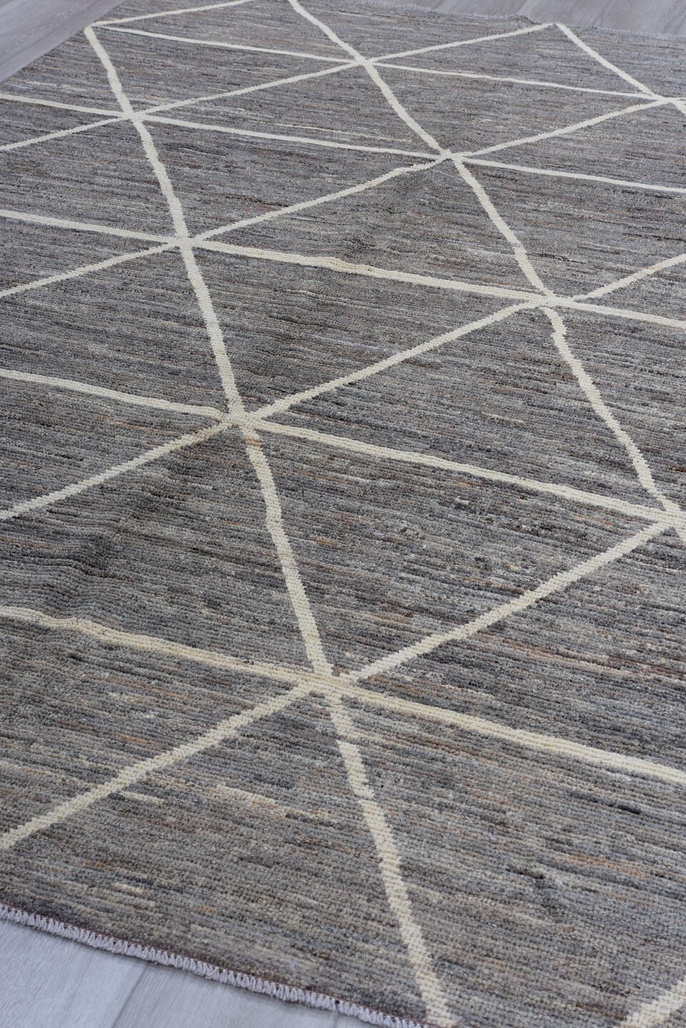 6' x 9' one-of-a-kind handmade vintage Tulu medium size rug. Color palette: gray, ivory, taupe, charcoal, beige, black