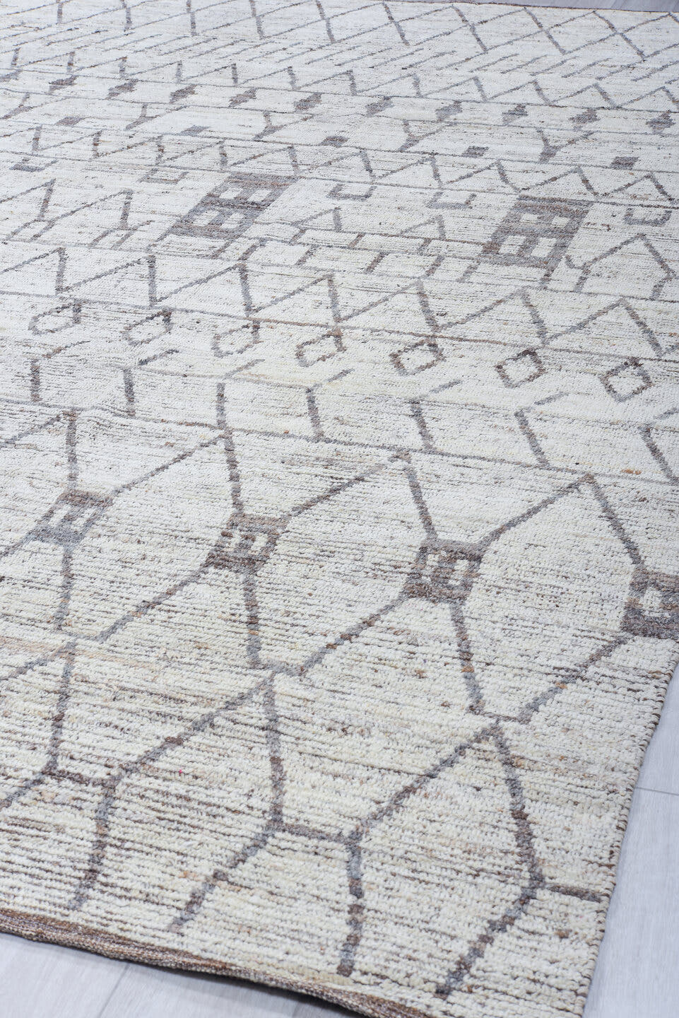 10' x 13' one-of-a-kind handmade vintage Tulu large size rug. Color palette: ivory, charcoal, taupe, brown, gray, black