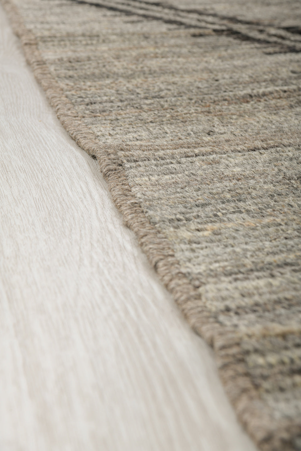 9' x 12' one-of-a-kind handmade vintage Tulu large size rug. Color palette: gray, charcoal, taupe, ivory, black, beige