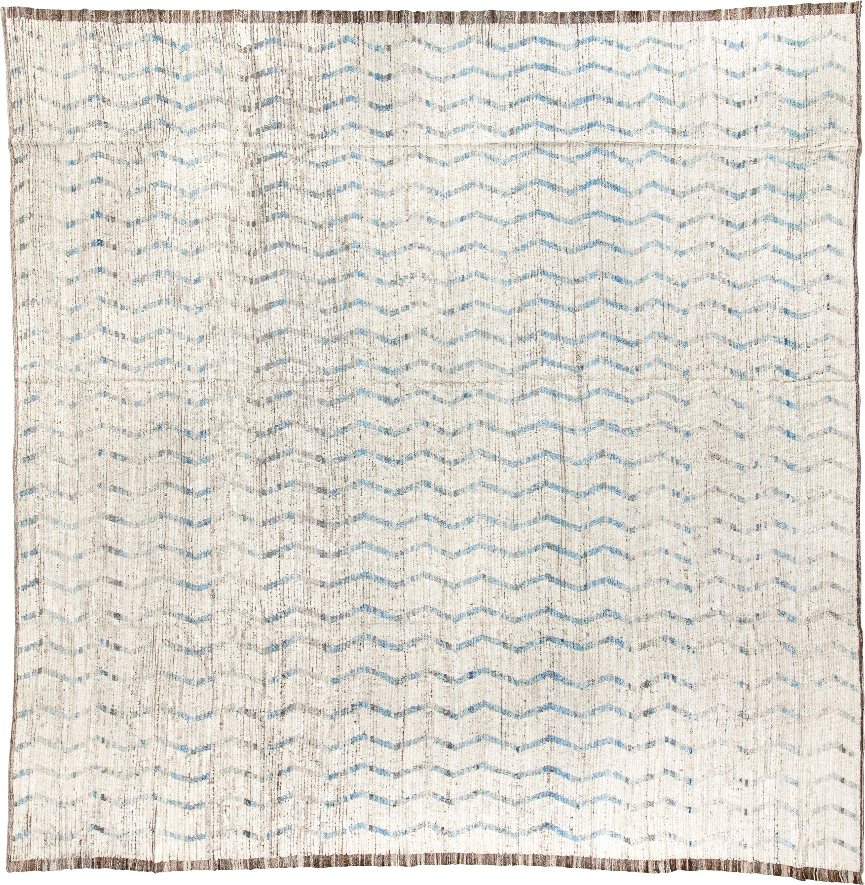 12' x 12' one-of-a-kind handmade vintage Tulu oversize rug. Color palette: ivory, pale blue, taupe, brown, light blue, beige