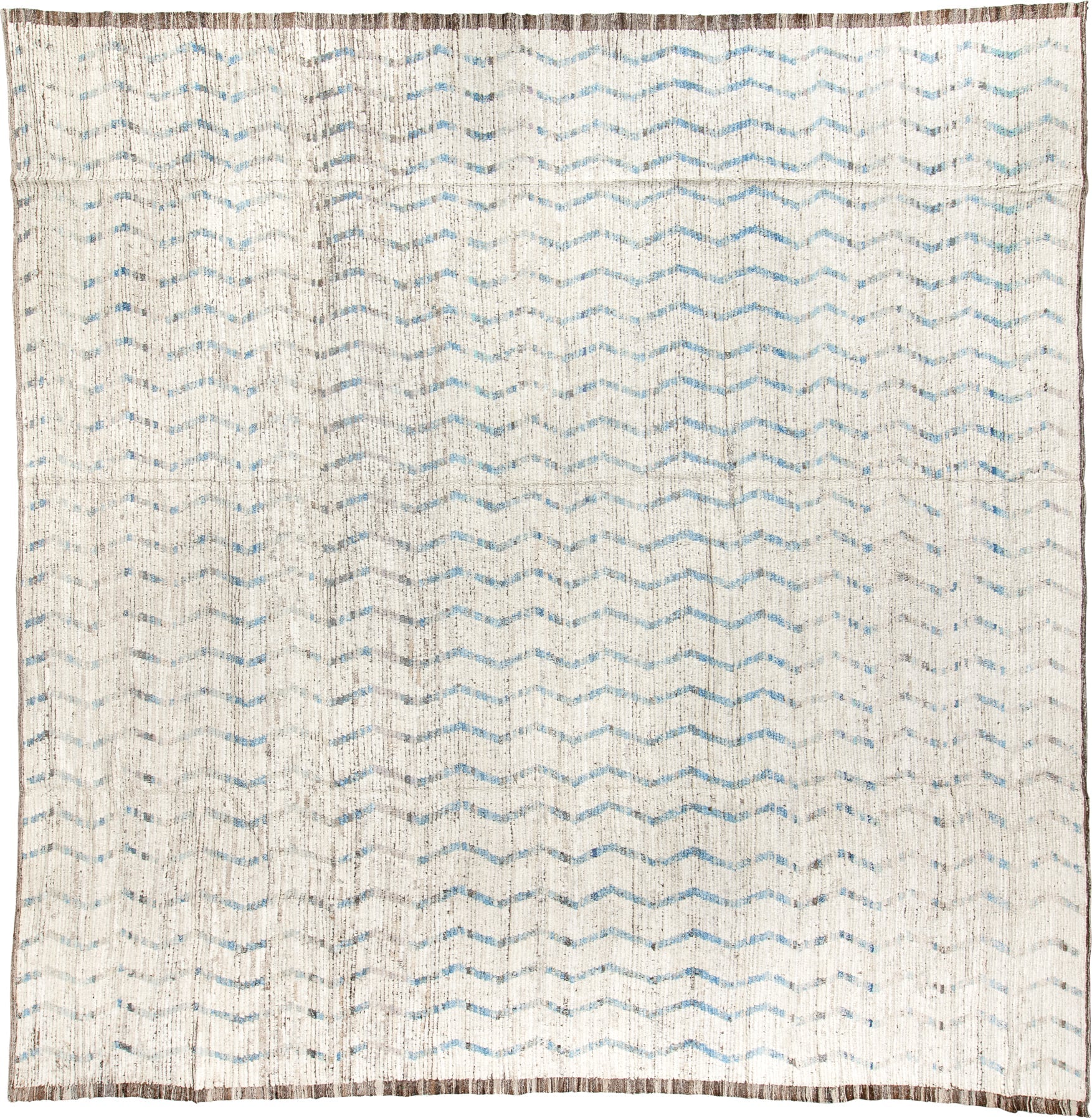 12' x 12' one-of-a-kind handmade vintage Tulu oversize rug. Color palette: ivory, pale blue, taupe, brown, light blue, beige