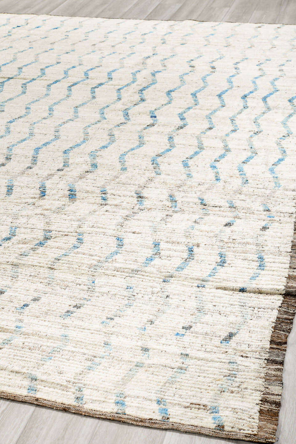 12' x 12' one-of-a-kind handmade vintage Tulu oversize rug. Color palette: ivory, pale blue, taupe, brown, light blue, beige