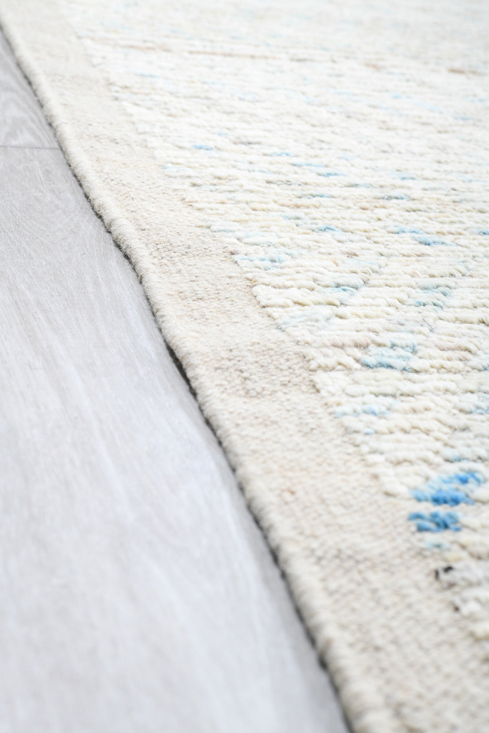 13' x 16' one-of-a-kind handmade vintage Tulu oversize rug. Color palette: ivory, pale blue, cream, taupe, light gray