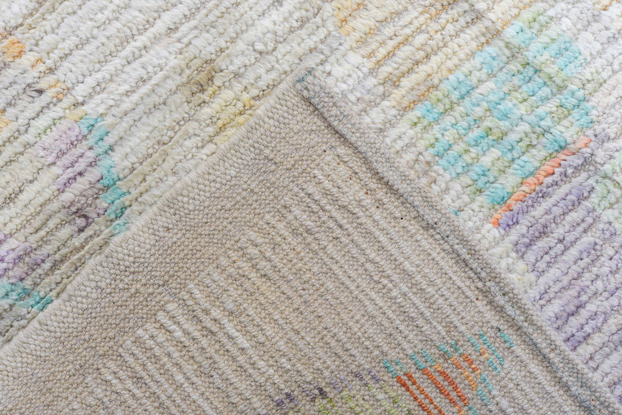 12' x 15' one-of-a-kind handmade vintage Tulu oversize rug. Color palette: ivory, aqua, lavender, apricot, pale blue, sage