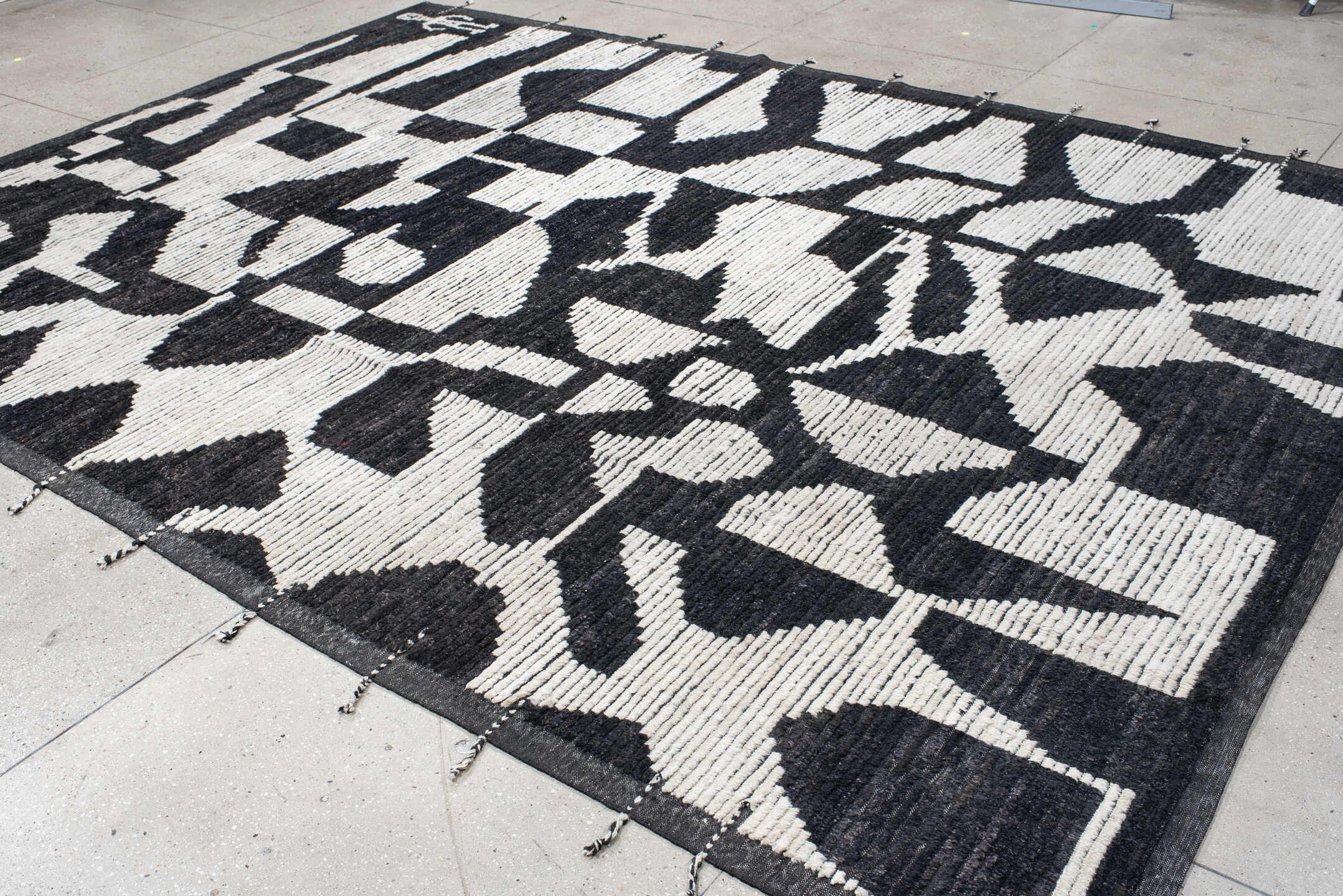 9' x 12' one-of-a-kind handmade vintage Tulu large size rug. Color palette: charcoal, ivory, gray, black