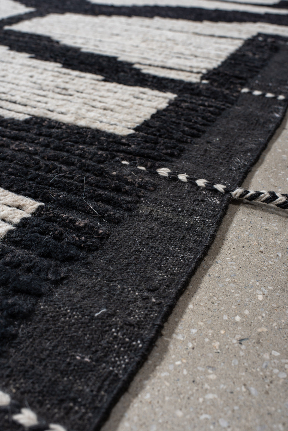 9' x 12' one-of-a-kind handmade vintage Tulu large size rug. Color palette: charcoal, ivory, gray, black
