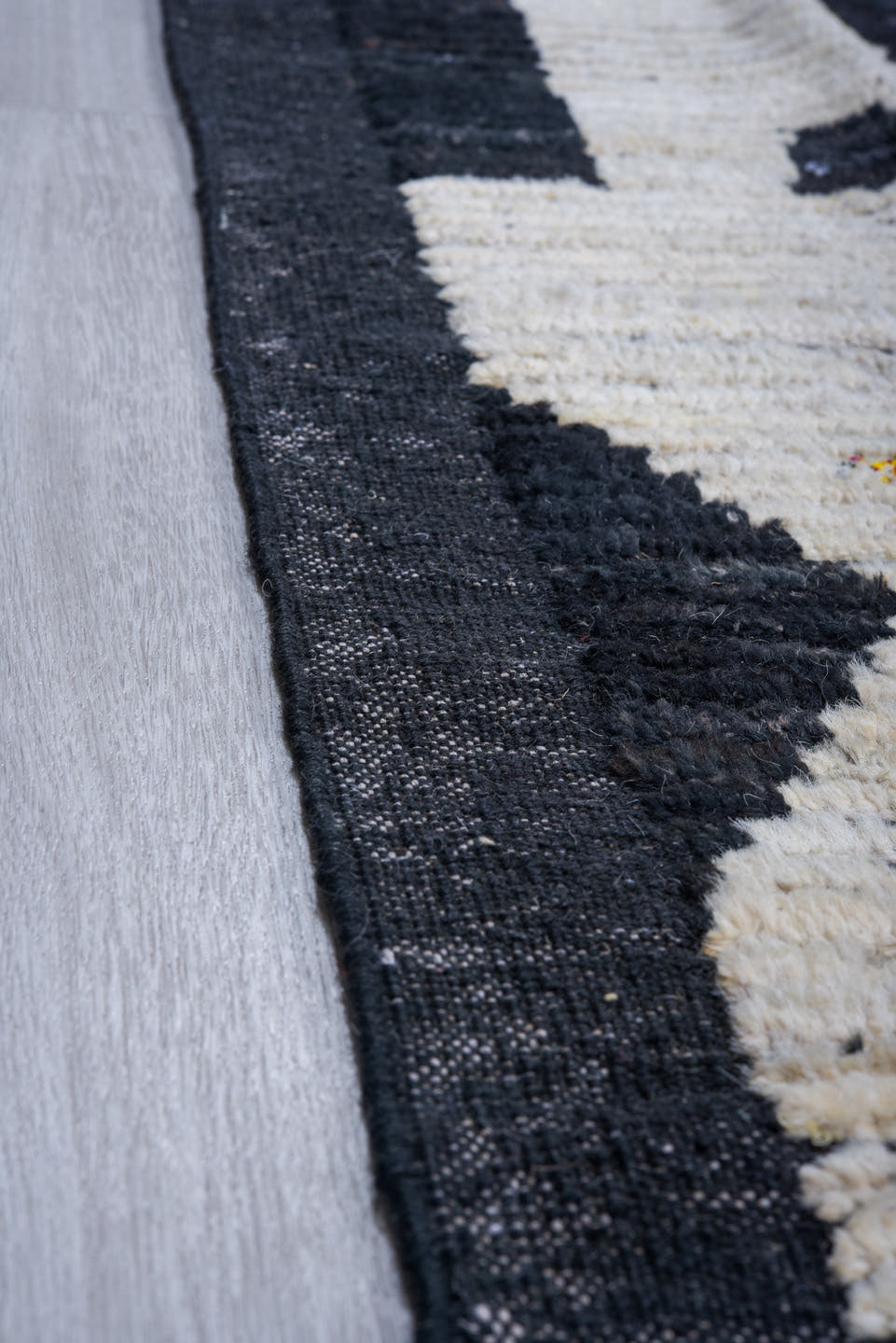 11' x 14' one-of-a-kind handmade vintage Tulu oversize rug. Color palette: black, ivory