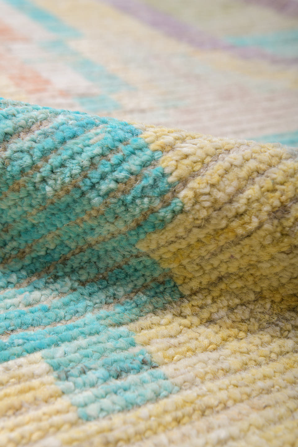 13' x 16' one-of-a-kind handmade vintage Tulu oversize rug. Color palette: ivory, aqua, apricot, lavender, taupe, coral