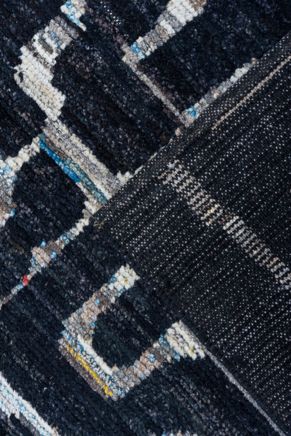 6' x 8' one-of-a-kind handmade vintage Tulu medium size rug. Color palette: black, blue, brown, charcoal, dark gray