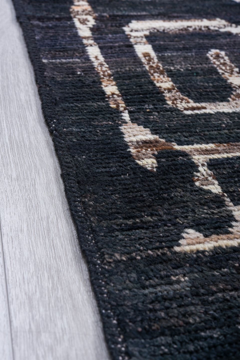 6' x 8' one-of-a-kind handmade vintage Tulu medium size rug. Color palette: black, blue, brown, charcoal, dark gray