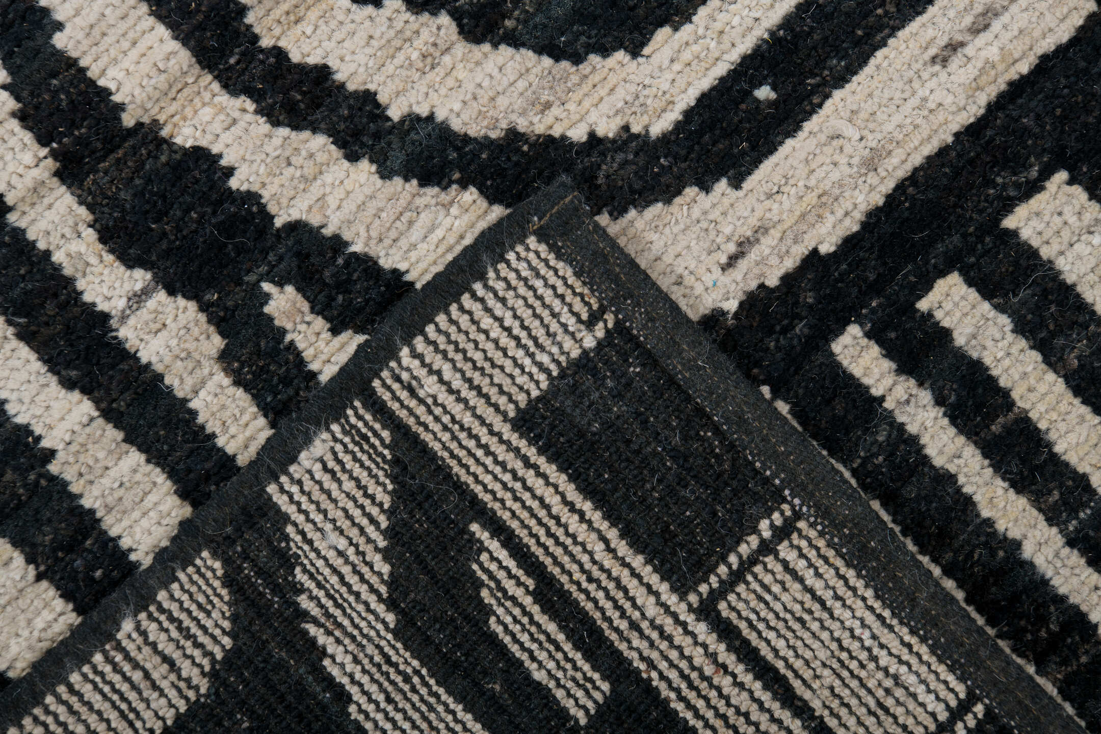 6' x 9' one-of-a-kind handmade vintage Tulu medium size rug. Color palette: ivory, charcoal, gray, black