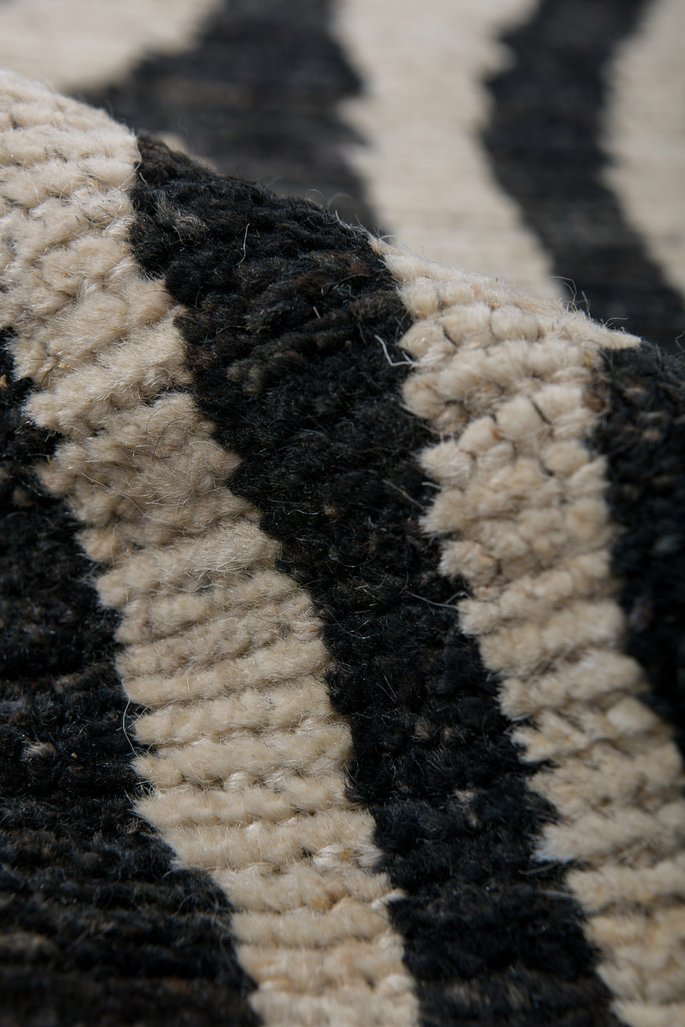 6' x 9' one-of-a-kind handmade vintage Tulu medium size rug. Color palette: ivory, charcoal, gray, black