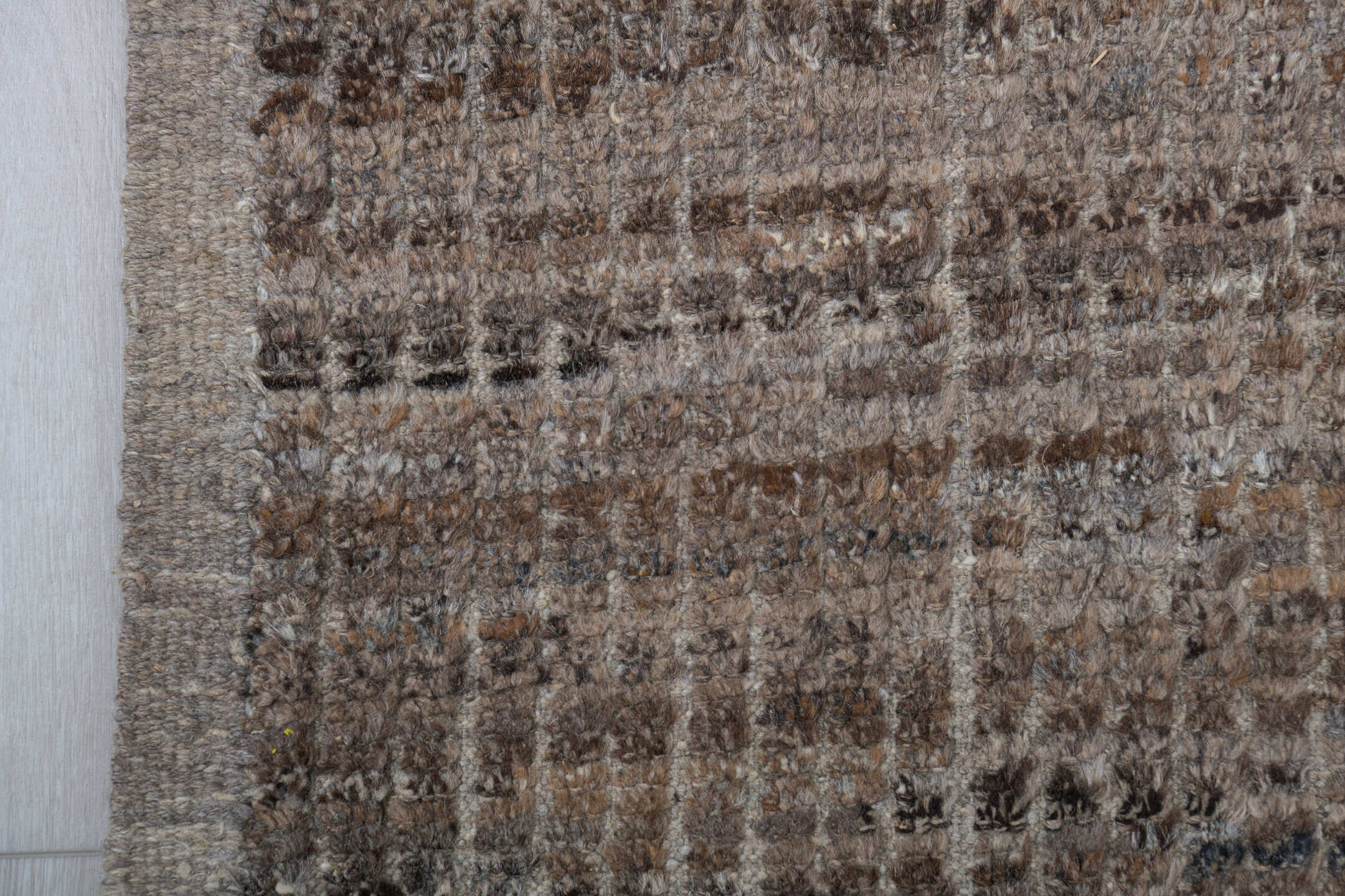 8' x 9' one-of-a-kind handmade vintage Tulu rug. Color palette: taupe, brown, ivory, gray, camel, charcoal, beige, black
