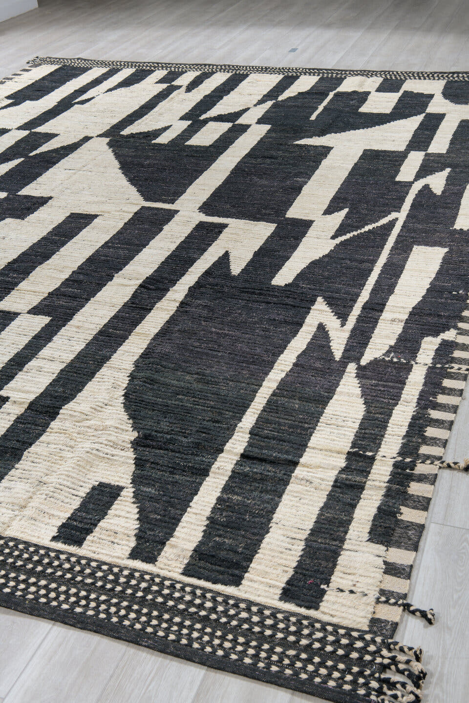 11' x 14' one-of-a-kind handmade vintage Tulu oversize rug. Color palette: ivory, black, charcoal, gray