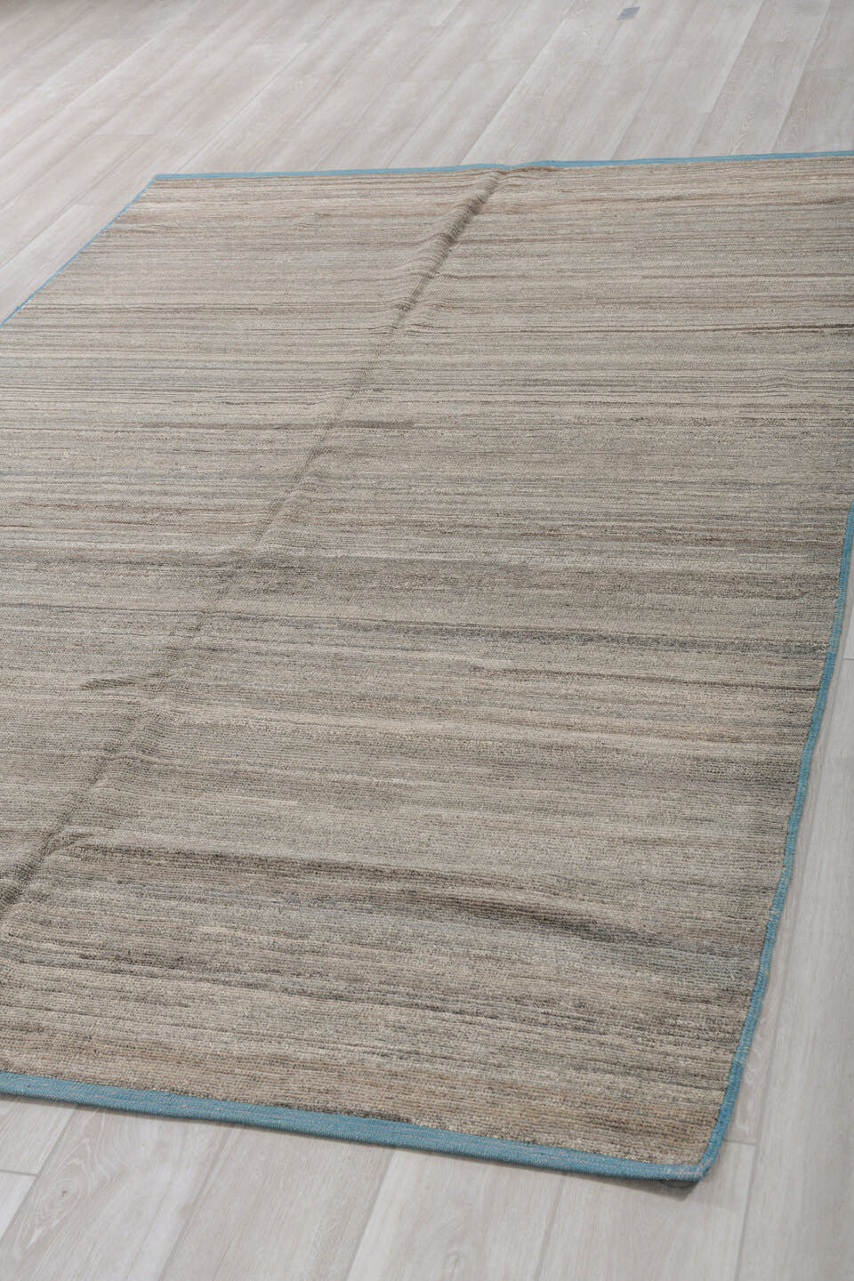 6' x 9' one-of-a-kind handmade vintage Tulu medium size rug. Color palette: taupe, ivory, charcoal, camel, sky_blue, beige