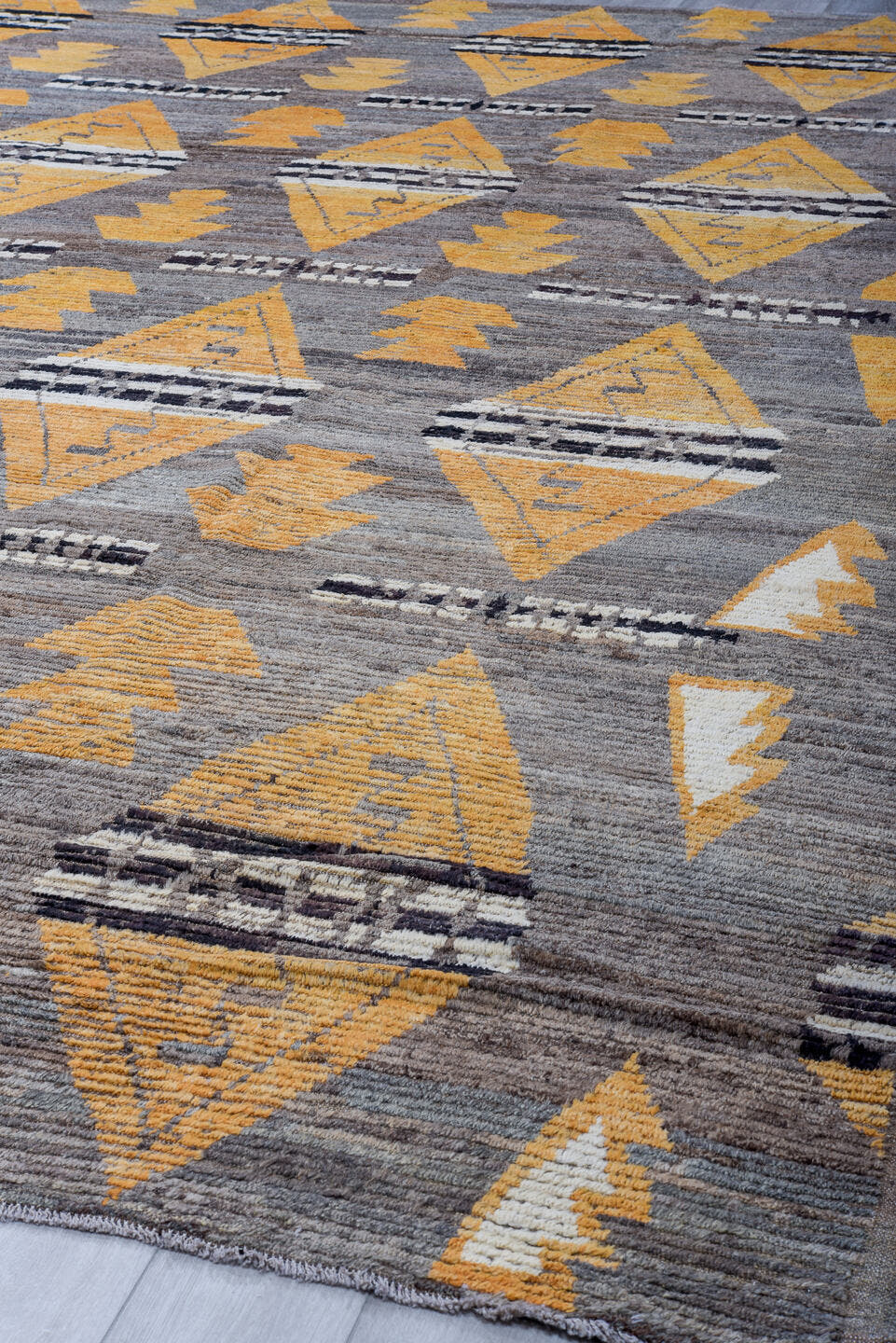 11' x 14' one-of-a-kind handmade vintage Tulu oversize rug. Color palette: gray, gold, ivory, charcoal, taupe, black, beige