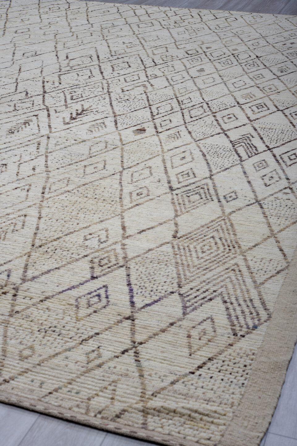 12' x 17' one-of-a-kind handmade vintage Tulu oversize rug. Color palette: ivory, taupe, brown, beige, camel, gray